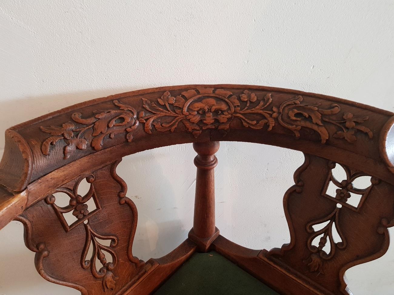 Antique Dutch oak corner chair decorated with carving in the style of Louis XIV, second half of the 19th century.

The measurements are,
Depth 64 cm/ 25.1 inch.
Width 65 cm/ 25.5 inch.
Height 80 cm/ 31.4 inch.
Seat height 50 cm/ 19.6 inch.
 