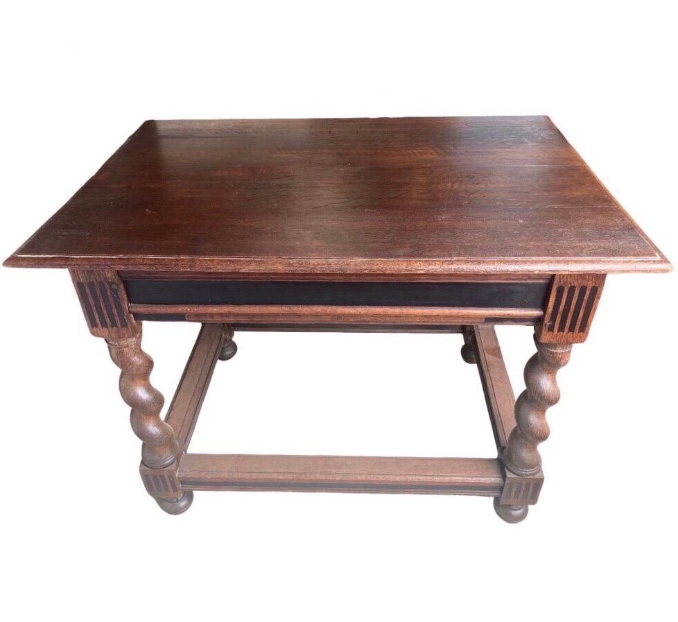Side table made in the Netherlands in the early 1800s using oak and pegged construction. The table is of a very versatile size, and can be used as a side table, or also center table or even as a small writing desk. 
The table is very simple and