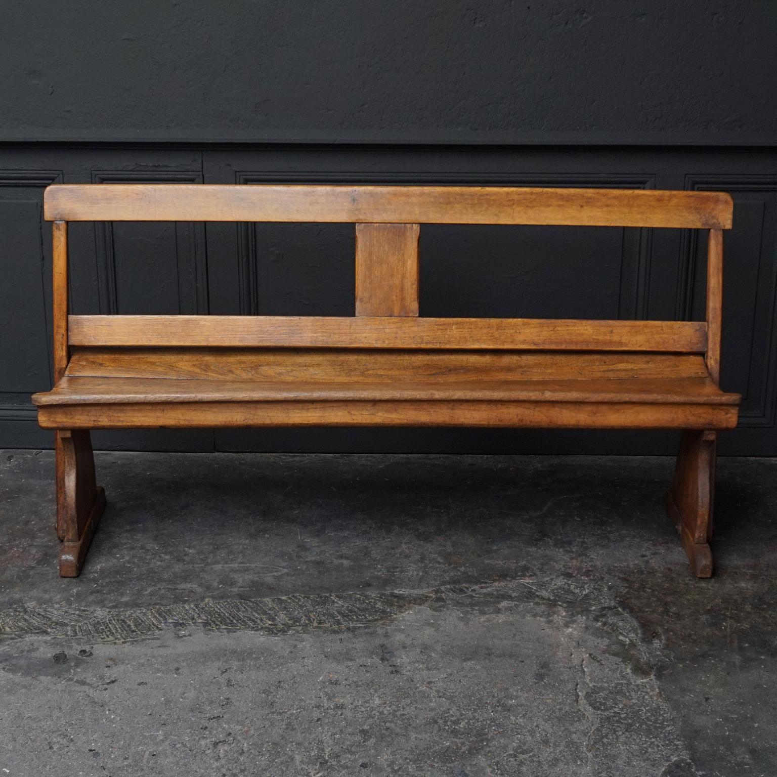 Imagine this pretty little 19th century oak bench in a kitchen, a hallway or on the patio.
It can be used from both sides by flipping the backrest, these flip benches are also known as Banc à tournis or Strycsitten.

These benches were very popular