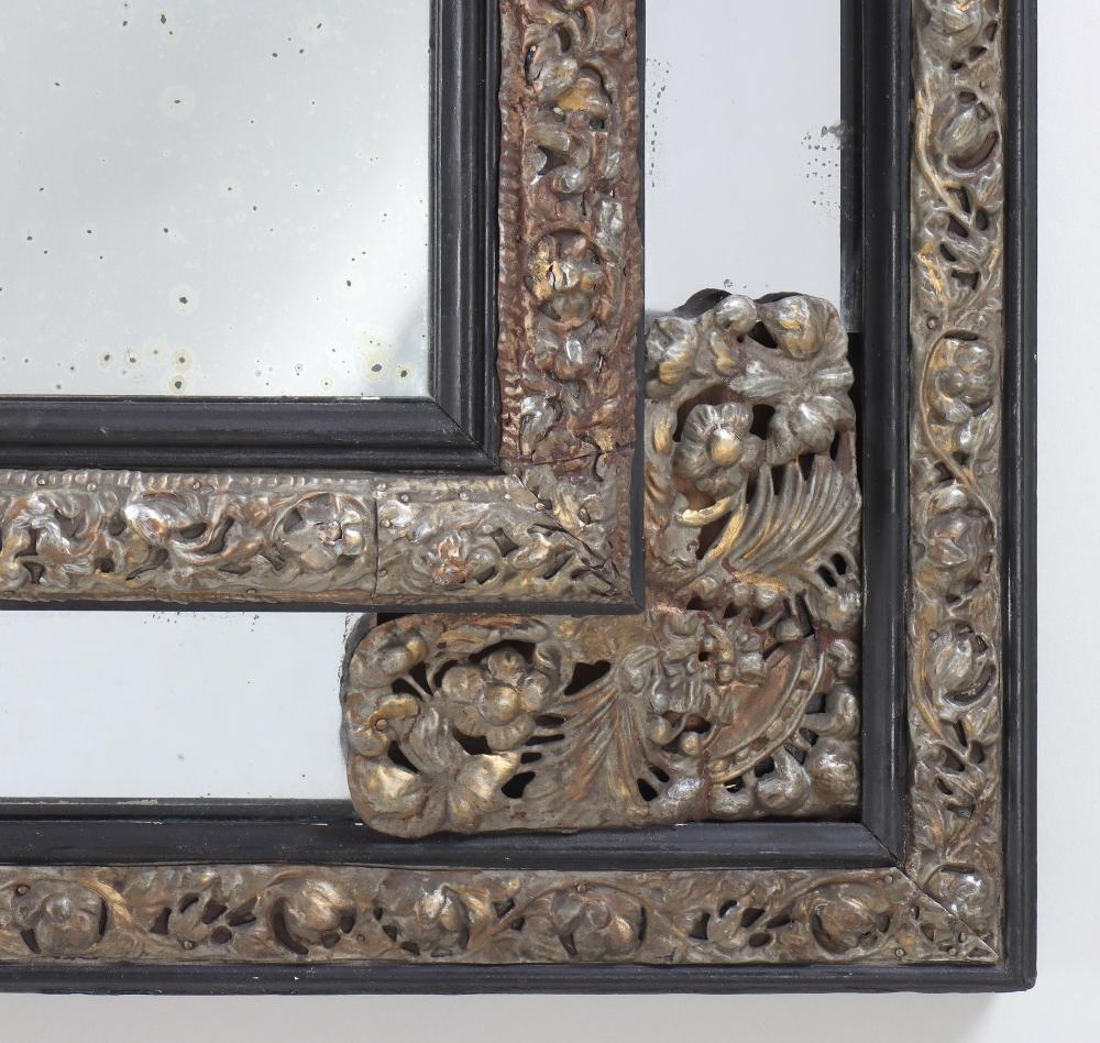 19th century Dutch repoussé gilt metal mirror with original glass

Anonymous
19th century; Netherlands
Metal, glass, ebonized wood

Approximate size: 38.25 x 33.5 inches

An elegant rectangular Dutch mirror framed by a beveled mirror-border mounted