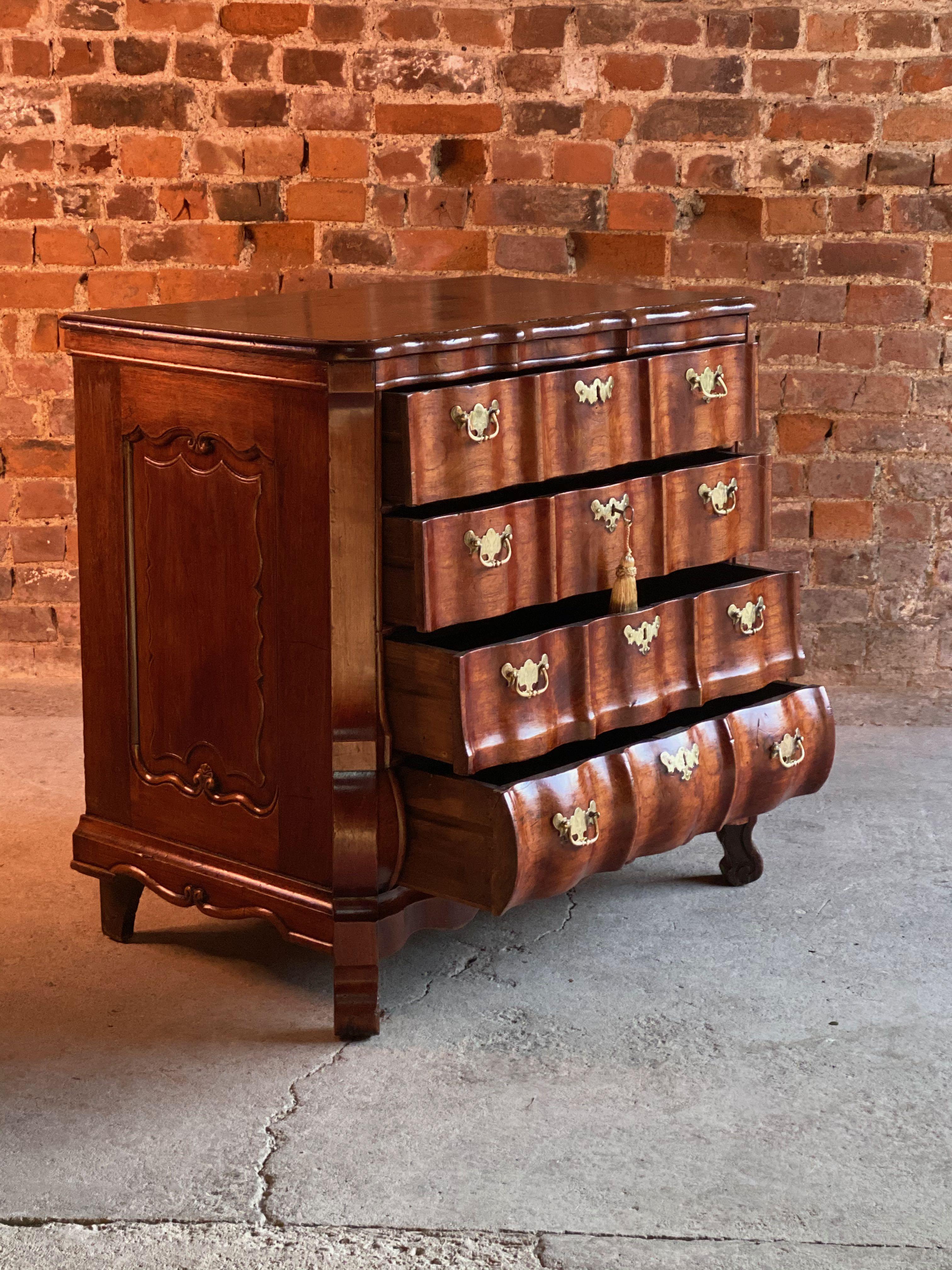 19th century Dutch rosewood bombe commode chest of drawers, circa 1820

We are delighted to offer this stunning early 19th century Dutch rosewood bombe commode chest of drawers, the scalloped shaped top over four graduated shaped drawers with
