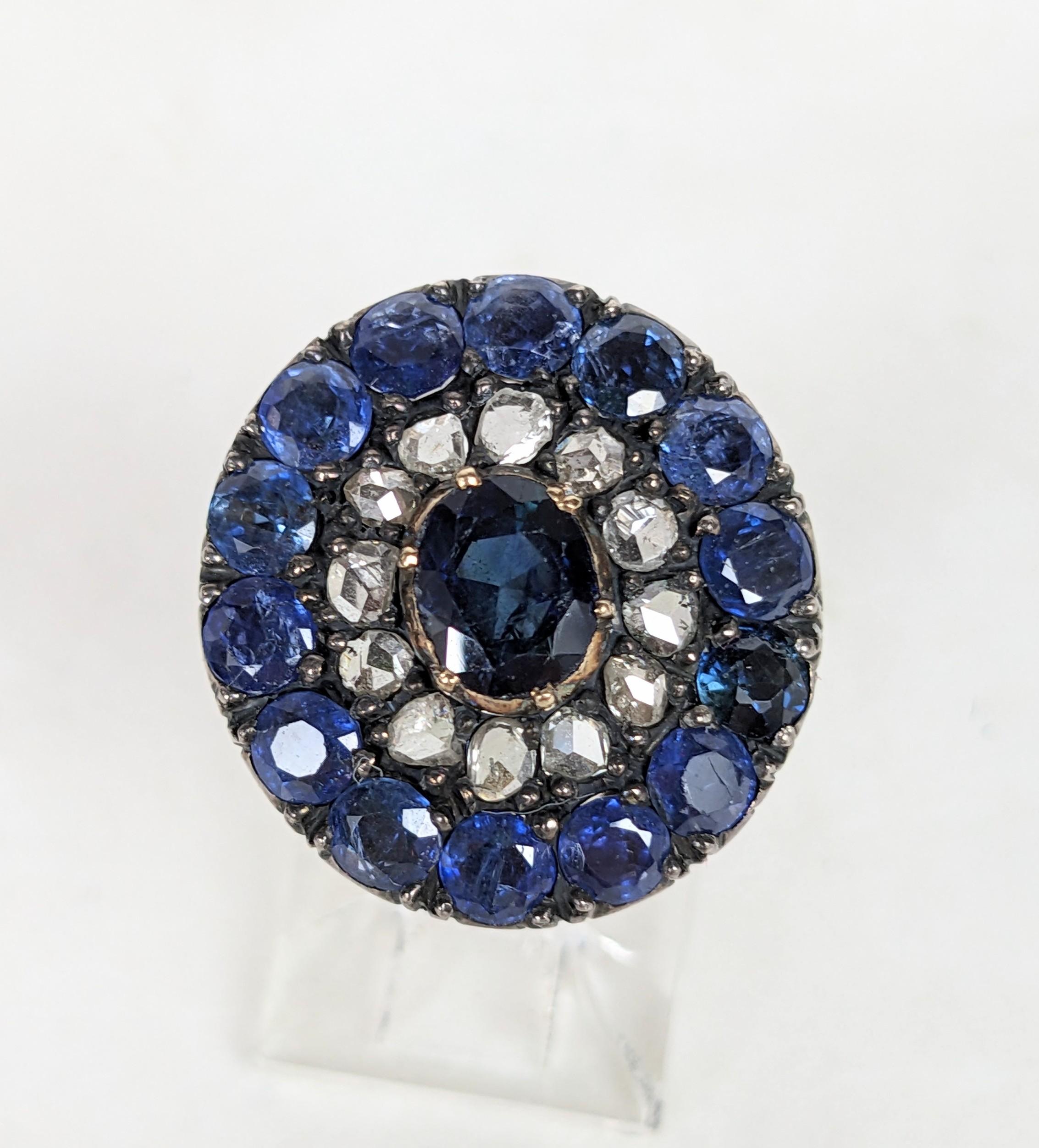 Lovely Dutch Sapphire and Rose Diamond Cluster Ring from the 19th Century. Cluster design with natural navy sapphires with chunky rose diamond concentric pattern. Elaborate hand etching on shoulders of 18K gold mount. Elegant timeless design.