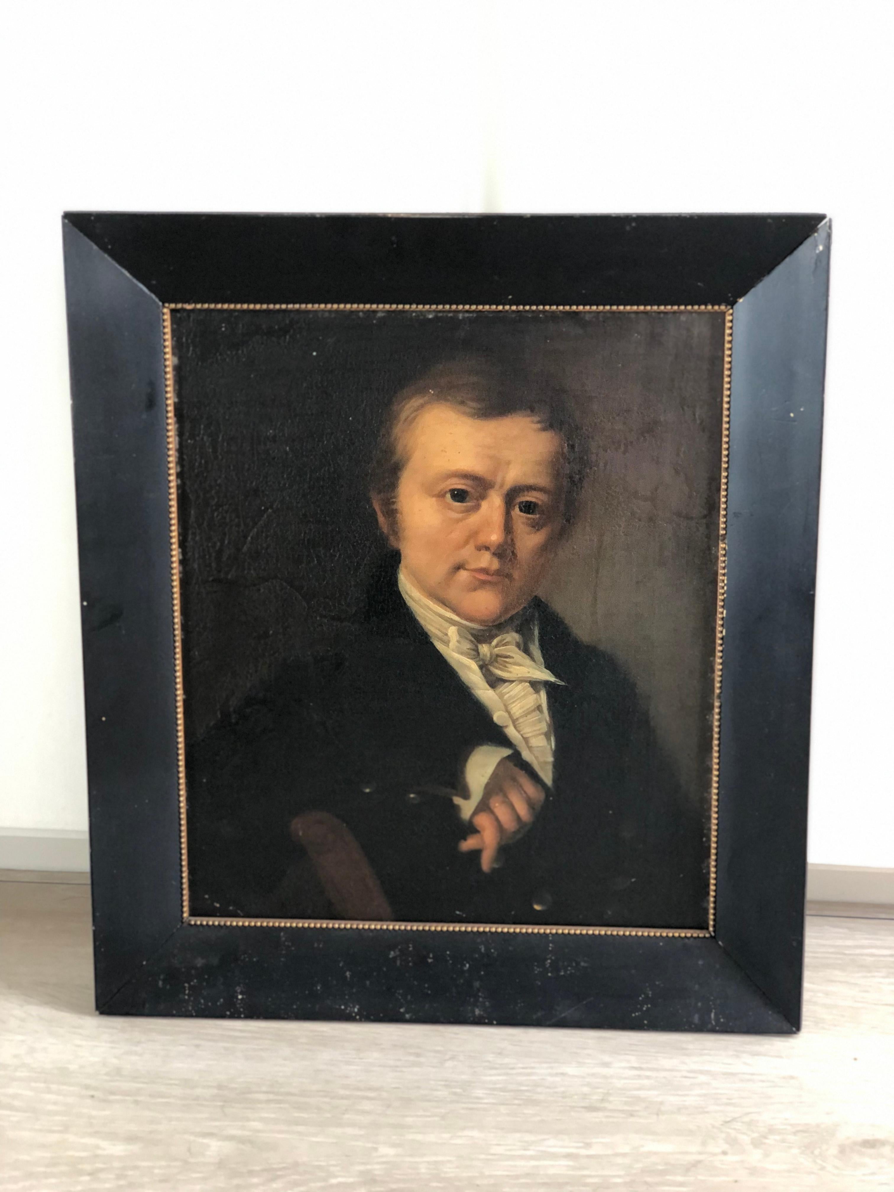 This dark captivating portrait painting from circa. 1840 captures the elegance and grandeur of the 19th century era in Holland perfectly. Painted by an artist of the Dutch School, this painting of a prominent gentleman offers a glimpse into the