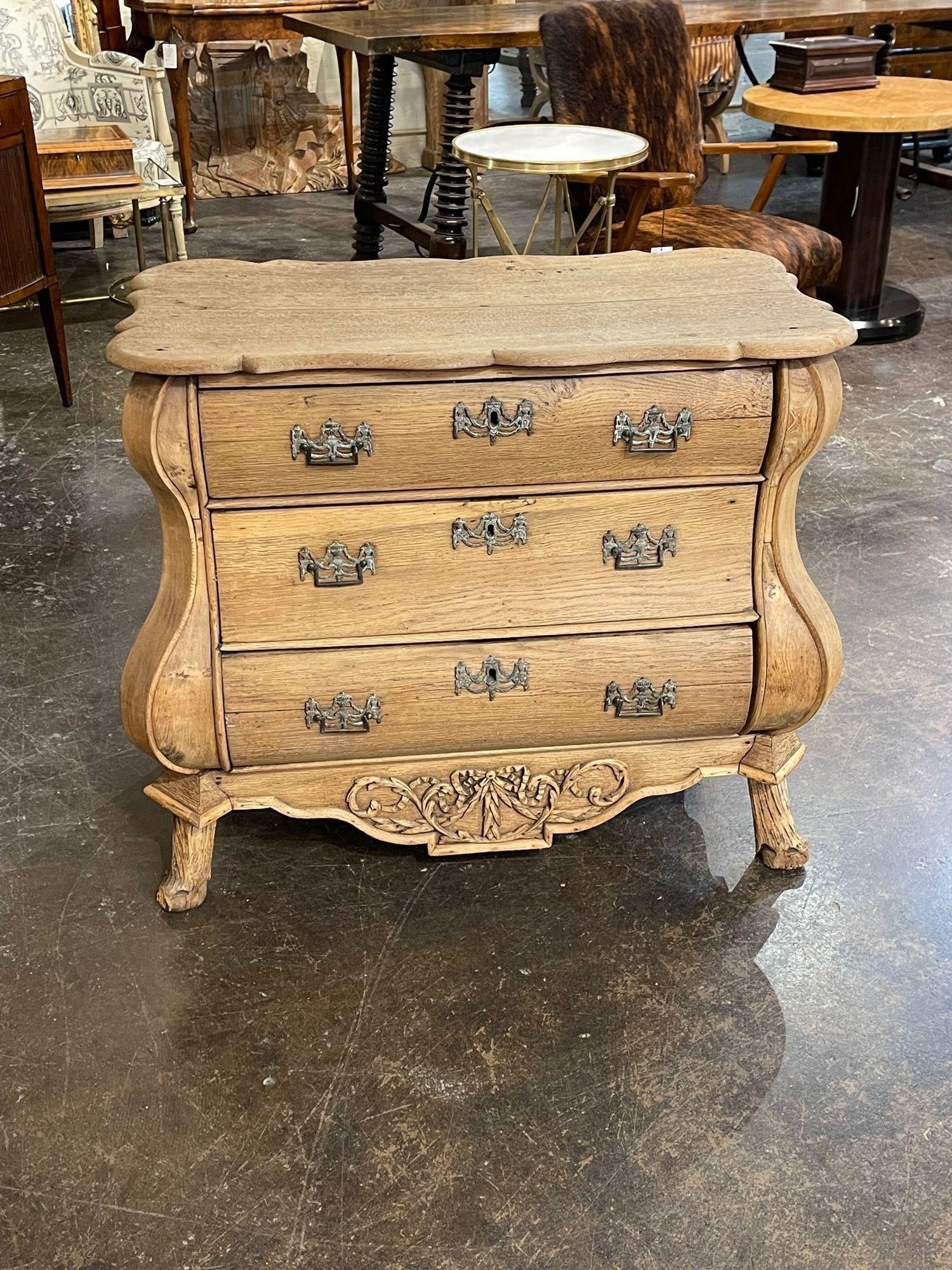 Handsome 19th century Dutch serpentine carved and bleached oak chest. Beautiful scale and shape on this piece and lovely patina as well. The chest also has 3 drawers for storage and nice carvings as well. Fabulous!