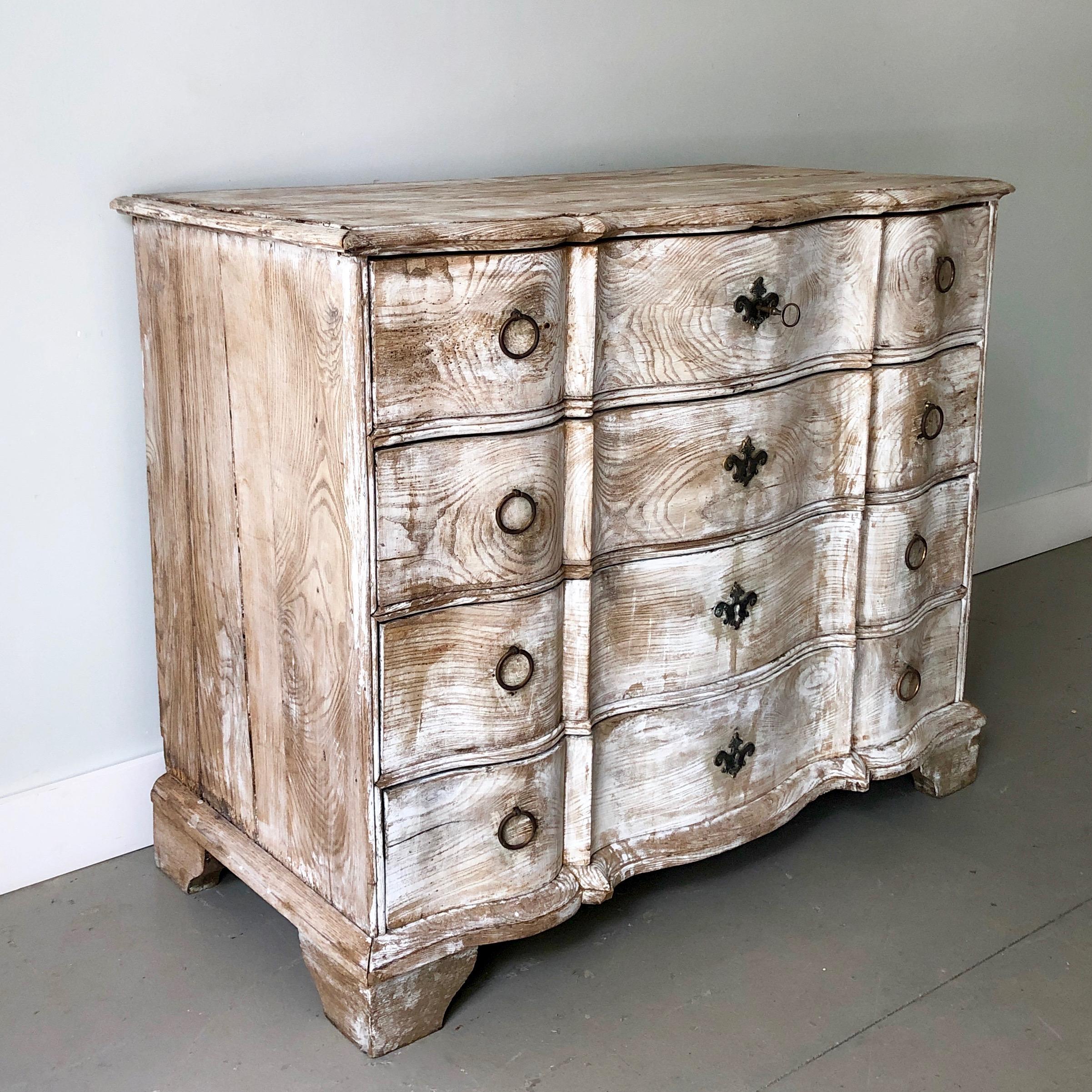 19th century four drawers Dutch chest in richly carved bleached oak with curvaceous serpentine drawer fronts, shaped top and block feet. 
Here are few examples … surprising pieces and objects, authentic, decorative and rare items that you will only
