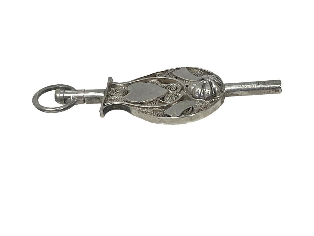 19th Century Dutch silver watch-key by Hendrik Krins, Schoonhoven

19th century silver watch-key in the shape of a musical instrument 
with filigree. The eyelet is marked by the Dutch silversmith hallmark of Hendrik Krins. This mark is used between