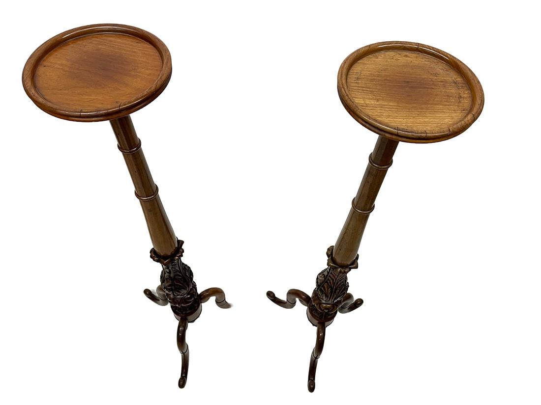 19th century Dutch wooden plant stands

2 plant stands Dutch 19th century mahogany with acanthus leaves on a curved tripod with scroll feet. 
The height of the plant stand is 122 cm and the foot is 41 cm x 41 cm. 
The diameter of the table is 21