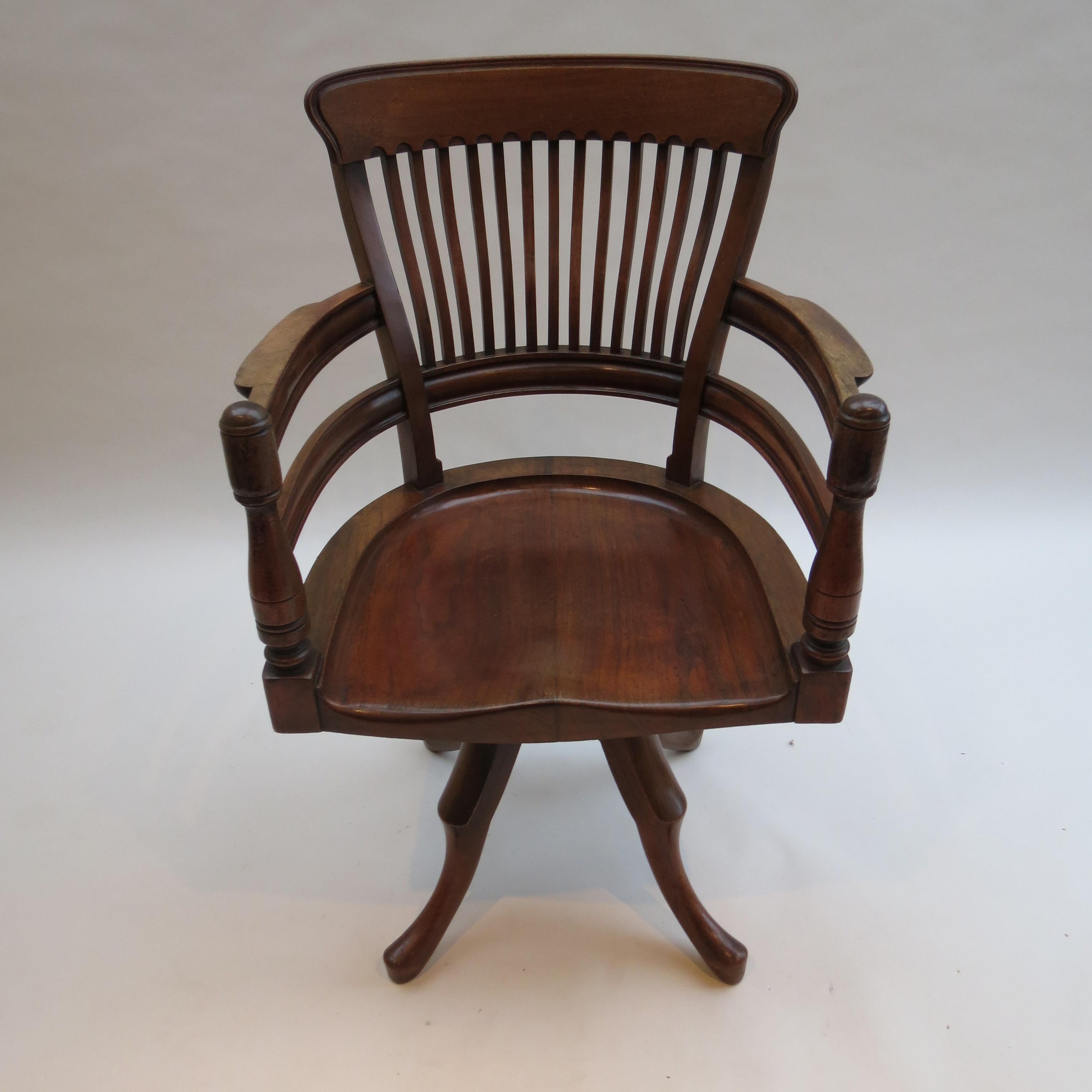 A fine example of this rare swivel office chair, designed by E W Godwin.  Exceptionally well crafted. Made from solid walnut

Retains the original finish. Beautiful color and patination.

In good overall condition, usual wear as expected.

A