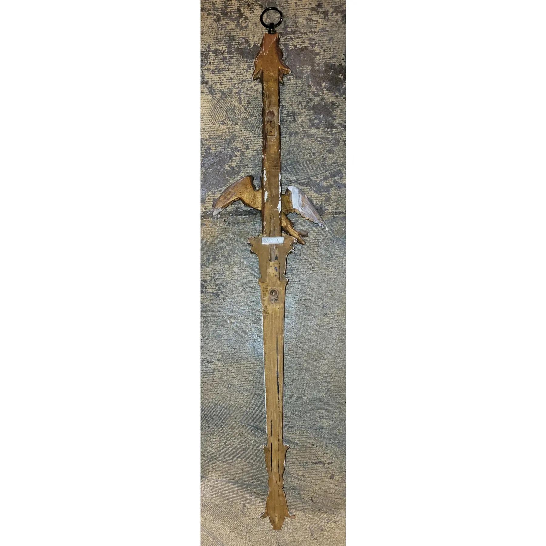 19thc Eagle Wall Mounted Ornament. This wall ornament has been made as a hanging ornament. Potential a finial at one time, there is a marriage of 2 pieces of wood connecting where the eagle stands.  The eagle is in its original paint and form.

42 x