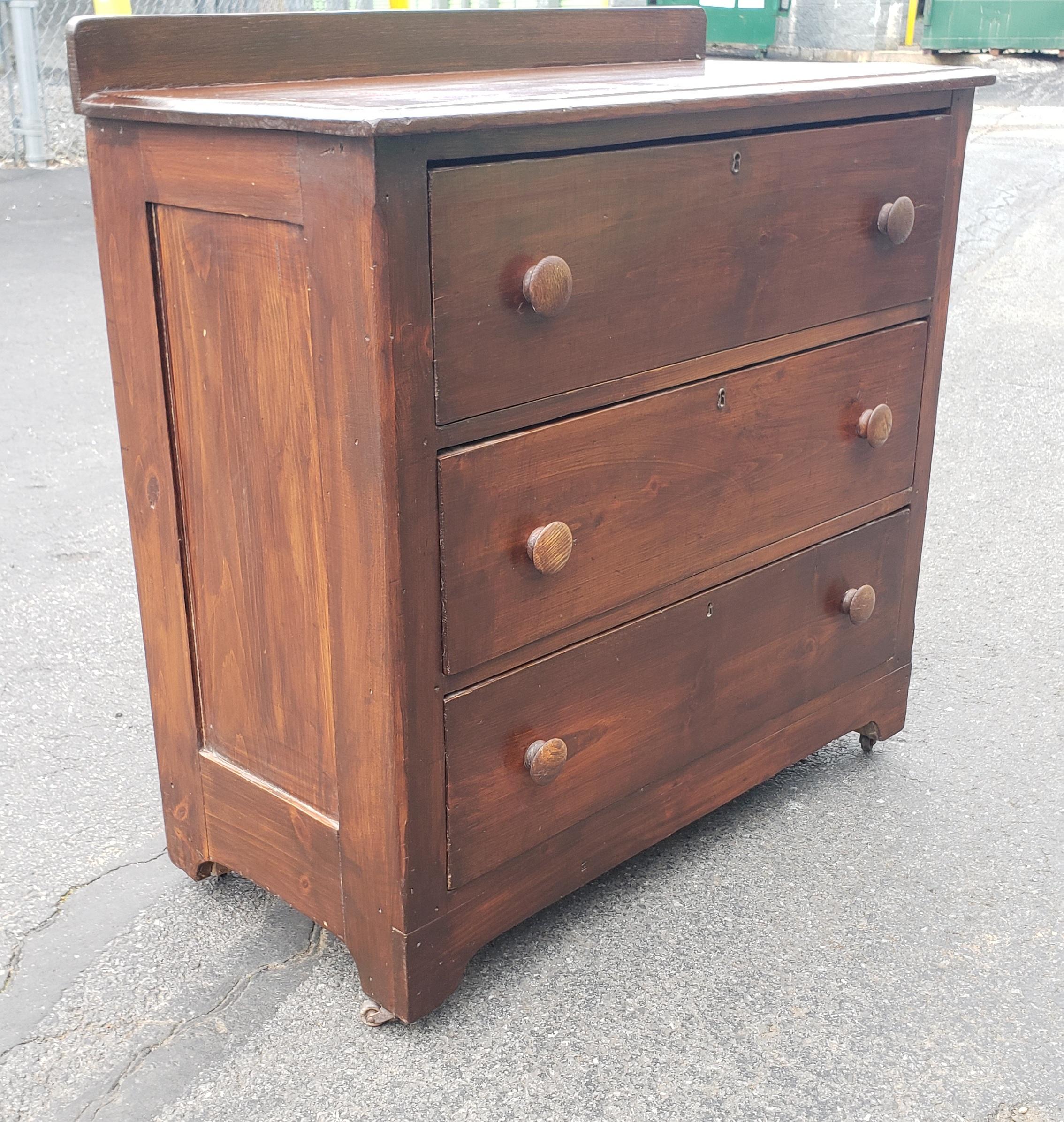 Hardwood 19th Century Early American Red Pine Chest of Drawers on Wheels For Sale