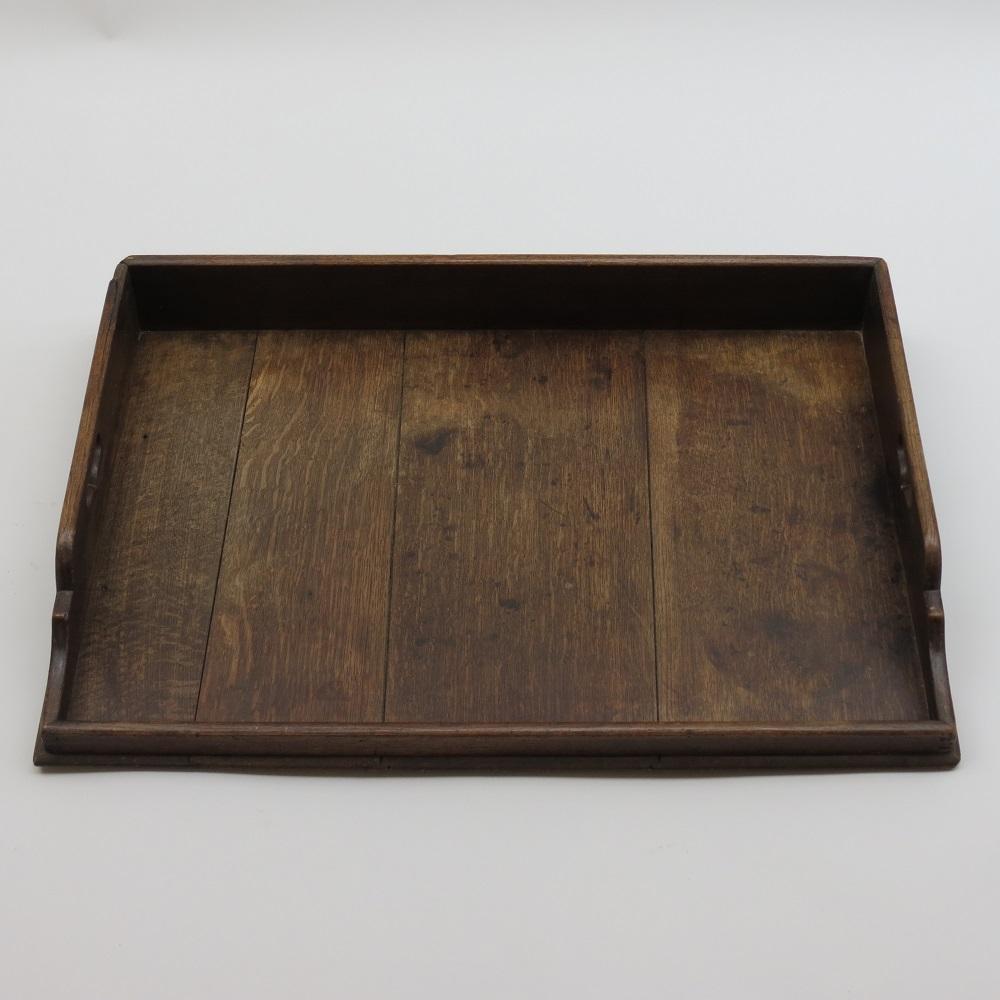 A large 19th Century Georgian Butlers tray, dates from the early 1800s, made from solid Oak, wonderful colour and patination all over.  Pieced handles either side allow for ease of carrying.  Dovetail joints to the corners. 
A wonderful, good