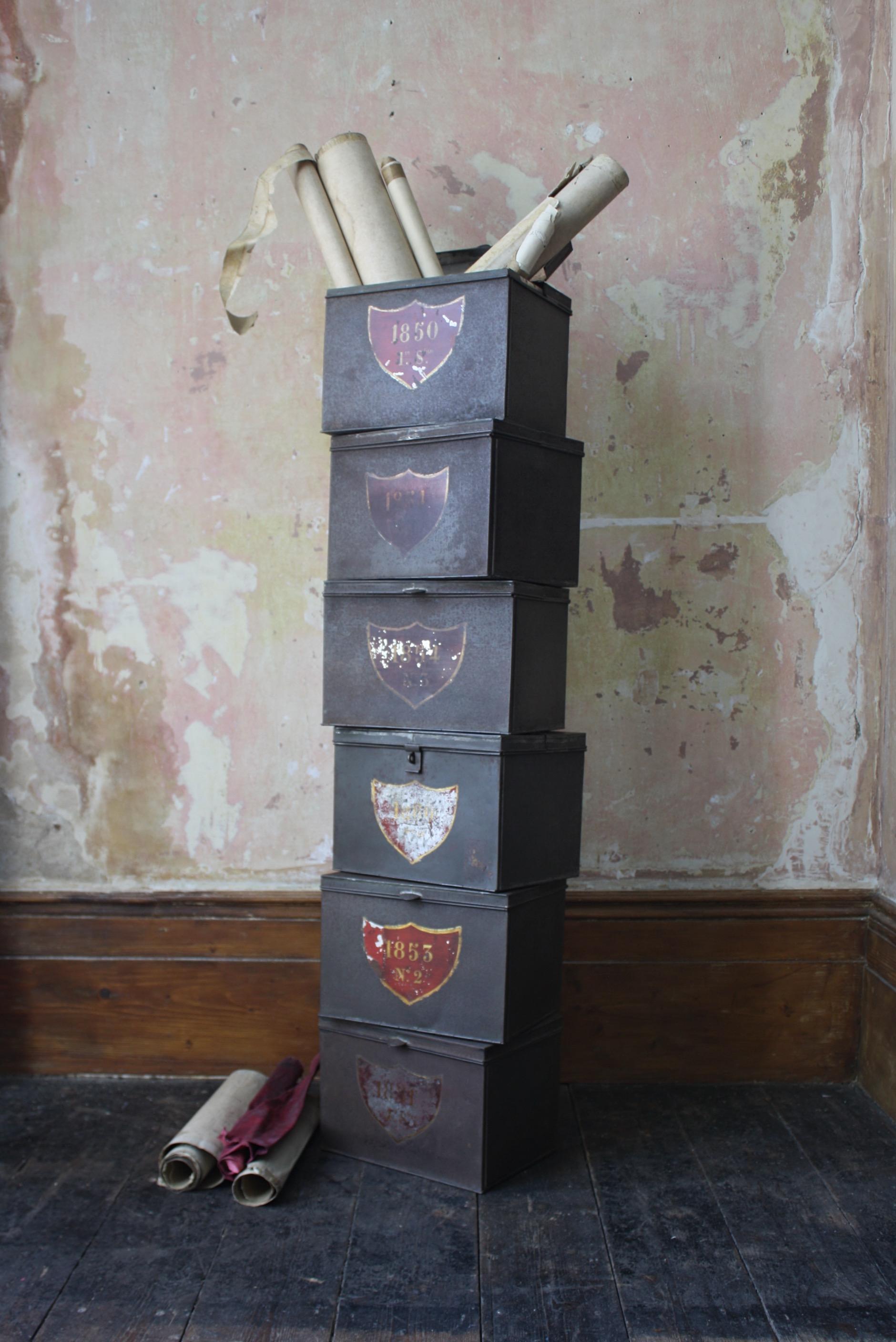 Collection of six sheet steel and hinged document boxes, with decorative squat Swiss style shields hand painted with dates and numbers.

Dating from 1850 to 1860 with differing amounts of wear to the paint work, highly decorative and