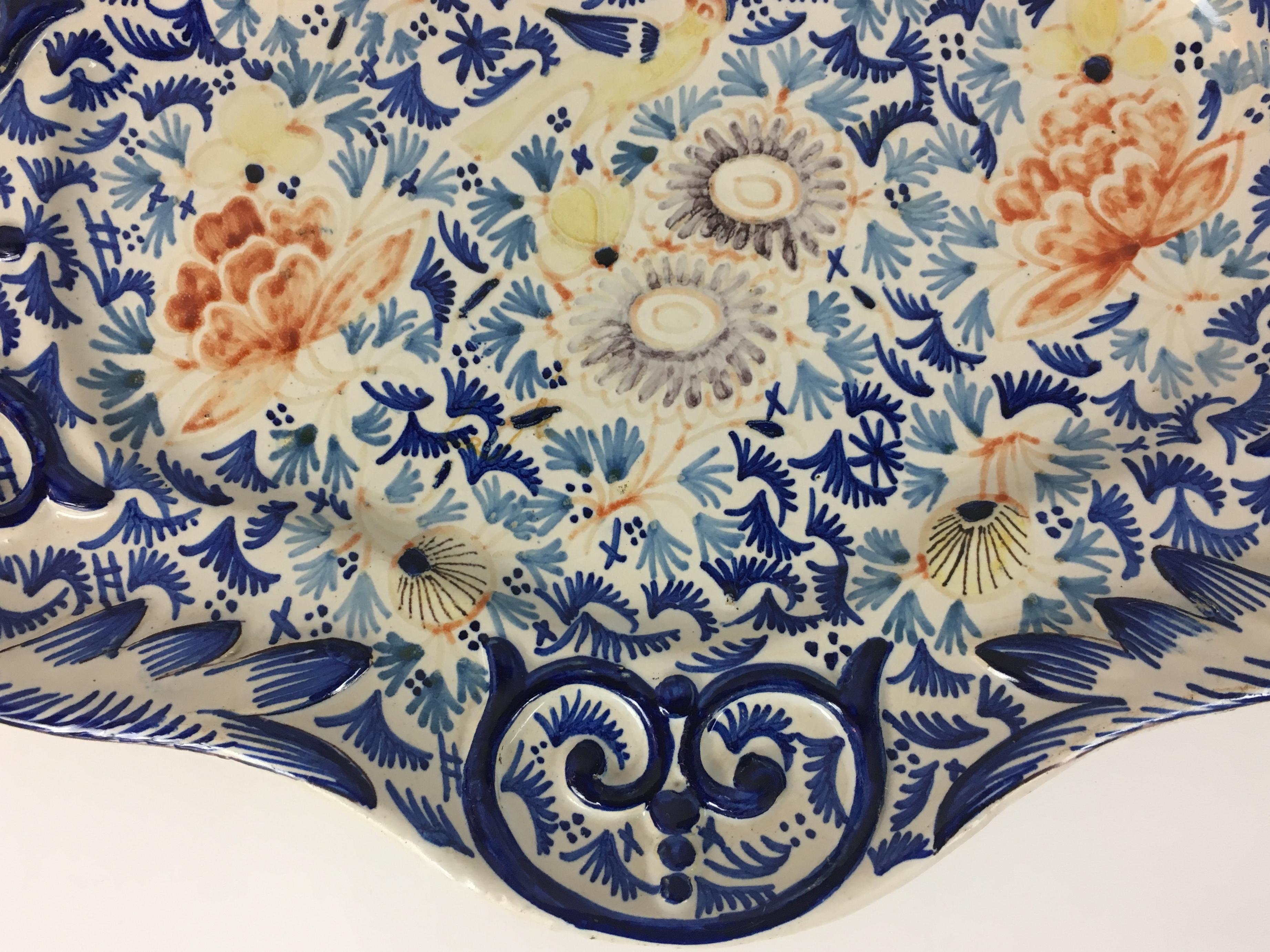 19th century Rouen earthenware platter with beautiful decoration France, circa 1750.
This traditional platter will enhance any table and your holiday serving dish selection. 

Good condition consistent with age, no visible cracks or chips.