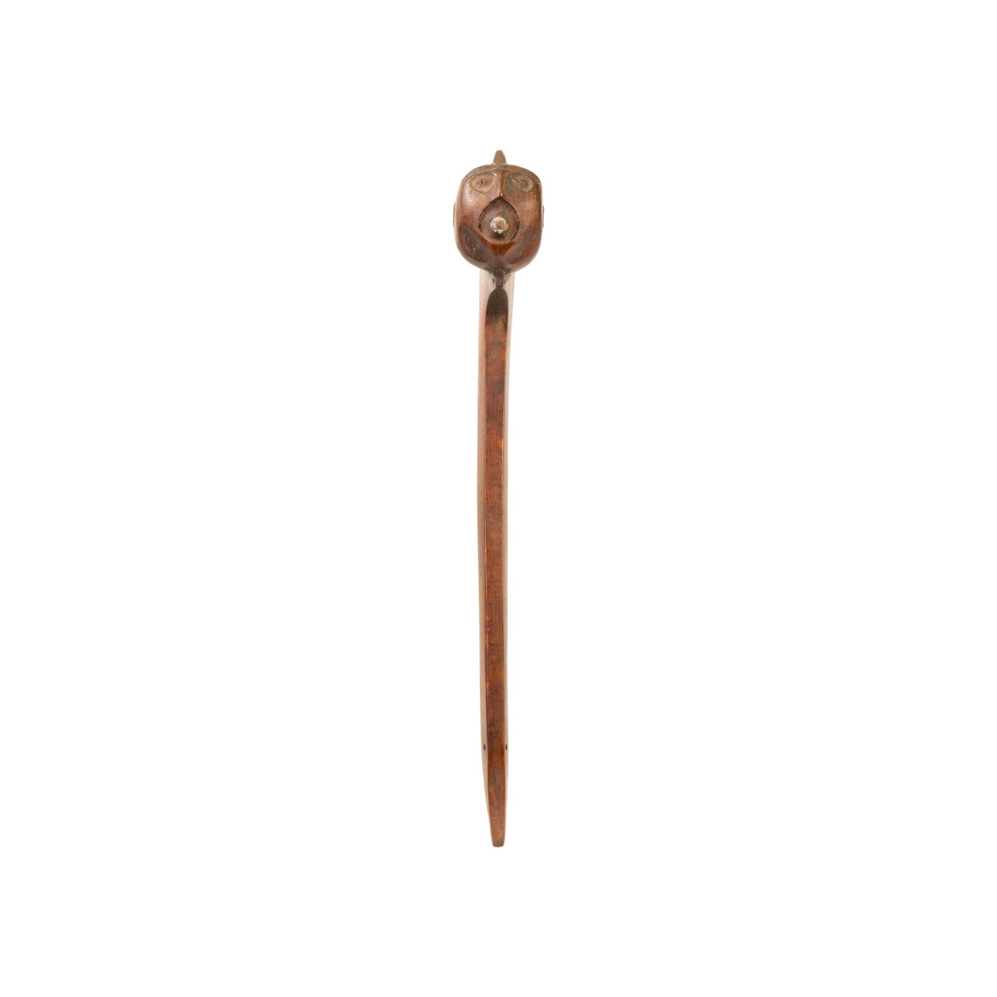 Eastern ball headed war club of native walnut with carved face having square nailed spike set in lead. Ex. Norm Johnson Estate.

Period: Mid-19th century
Origin: Eastern, US
Size: 21