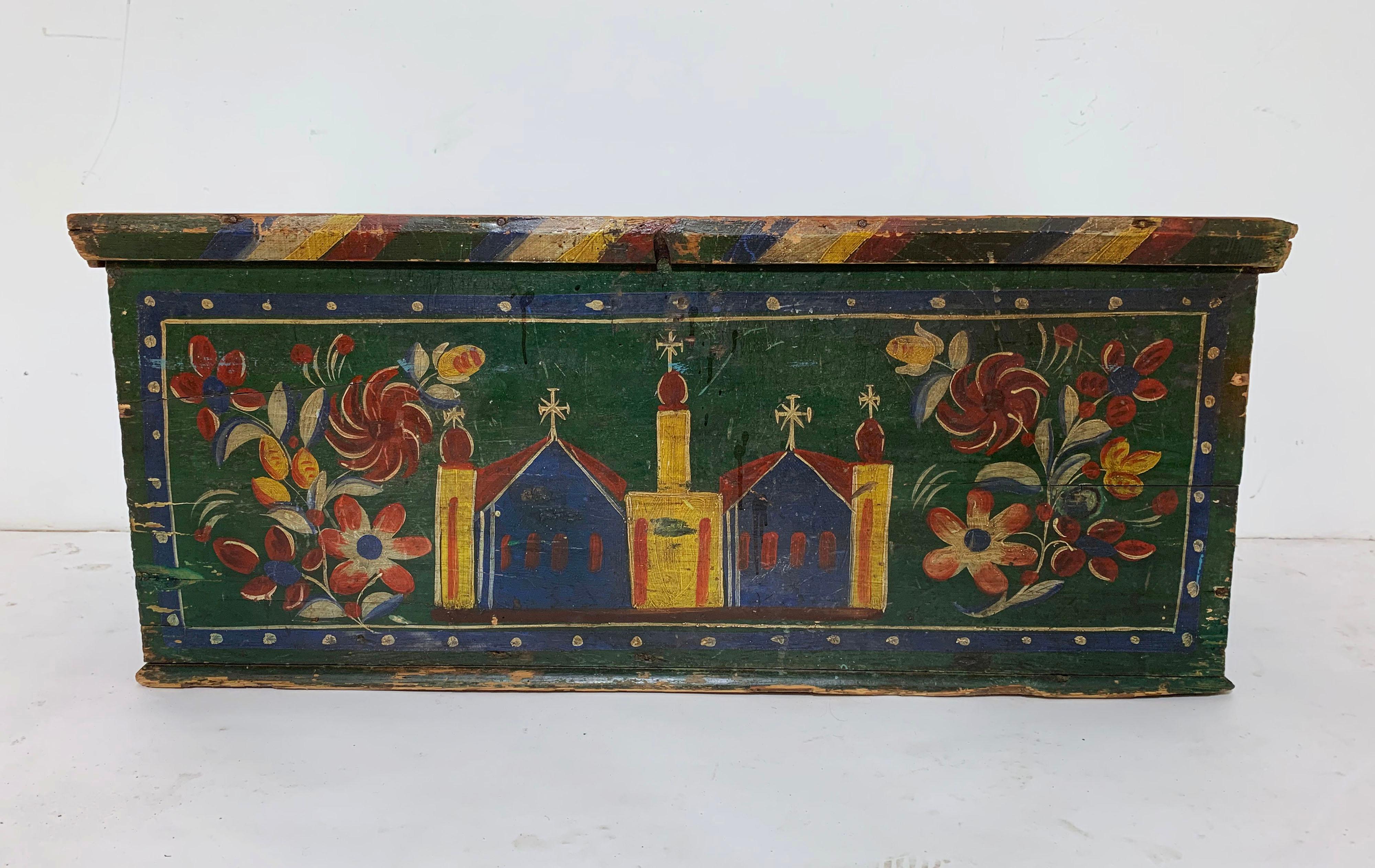 A mid-19th century, Eastern European Folk Art painted chest. This Baltic pine coffer was likely decorated as a wedding chest and used to transport a bride’s precious linens, collected since girlhood, to her husband’s home. The underside of the lid