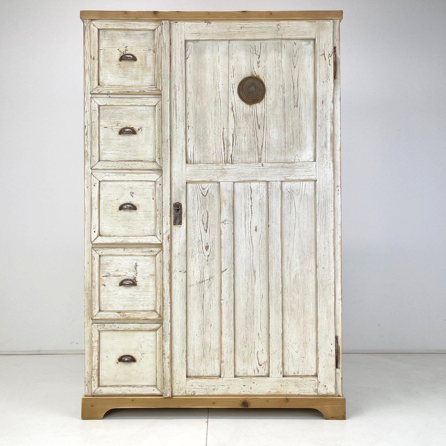 Wooden food cabinet from the end of the 19th century. It was rescued from a beautiful farmhouse in the Czech Republic. It has been thoroughly cleaned and lightly sanded. The patina and handles are original. Only the top and bottom mouldings have