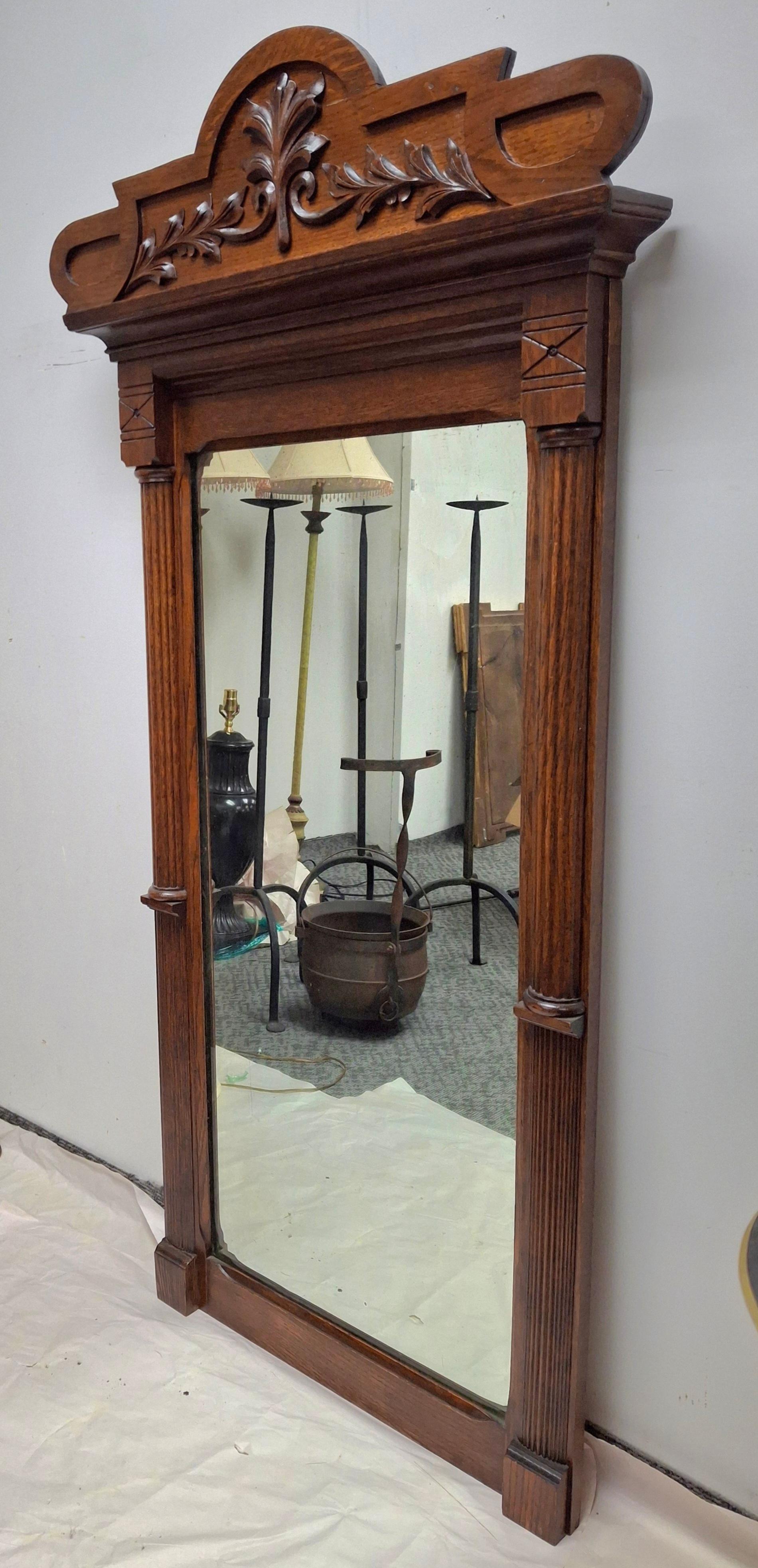 Tacheté 19th Century Eastlake Carved Oak Wall Mirror en vente