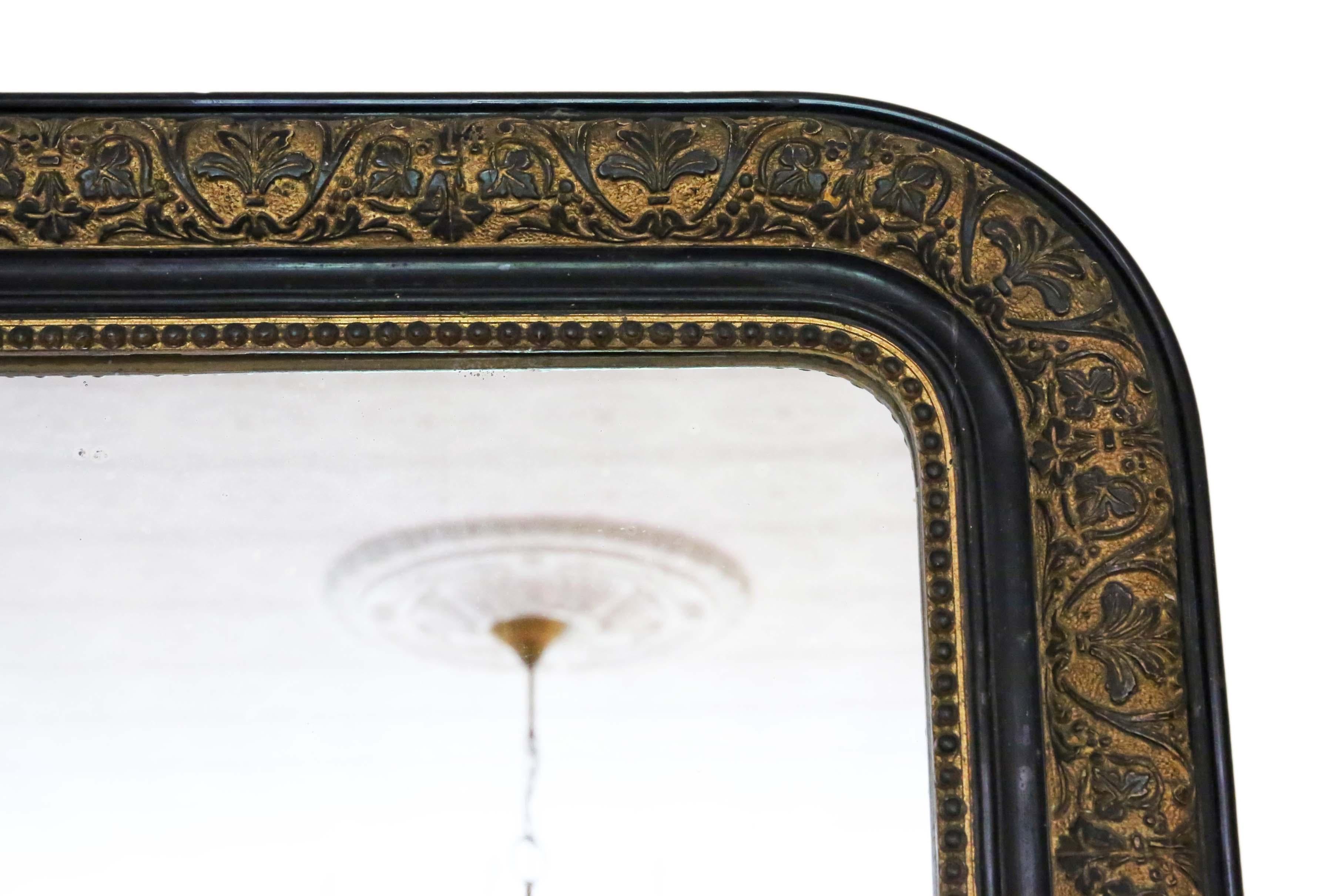 Antique large quality late 19th century ebonised and gilt finish overmantle wall mirror.
A charming mirror, that is full of age and character. The frame has most of it's original finish, with wear and patina. Also, losses that have been