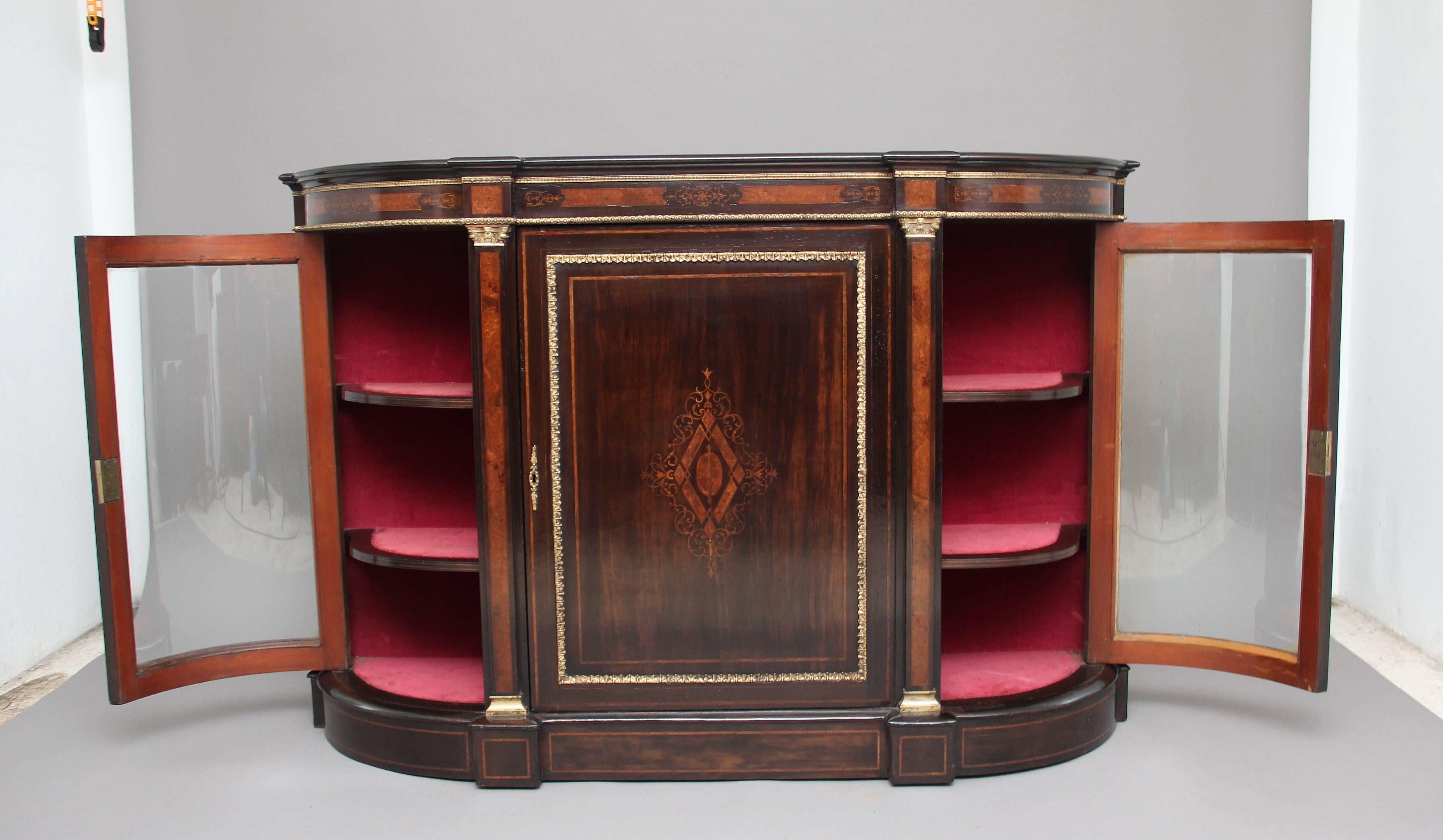 19th century ebonised and inlaid credenza, the shaped top above a frieze which is decorated with a nice inlaid pattern and having an ormolu beading running along the top and bottom, the front of the credenza having a central door with an inlaid