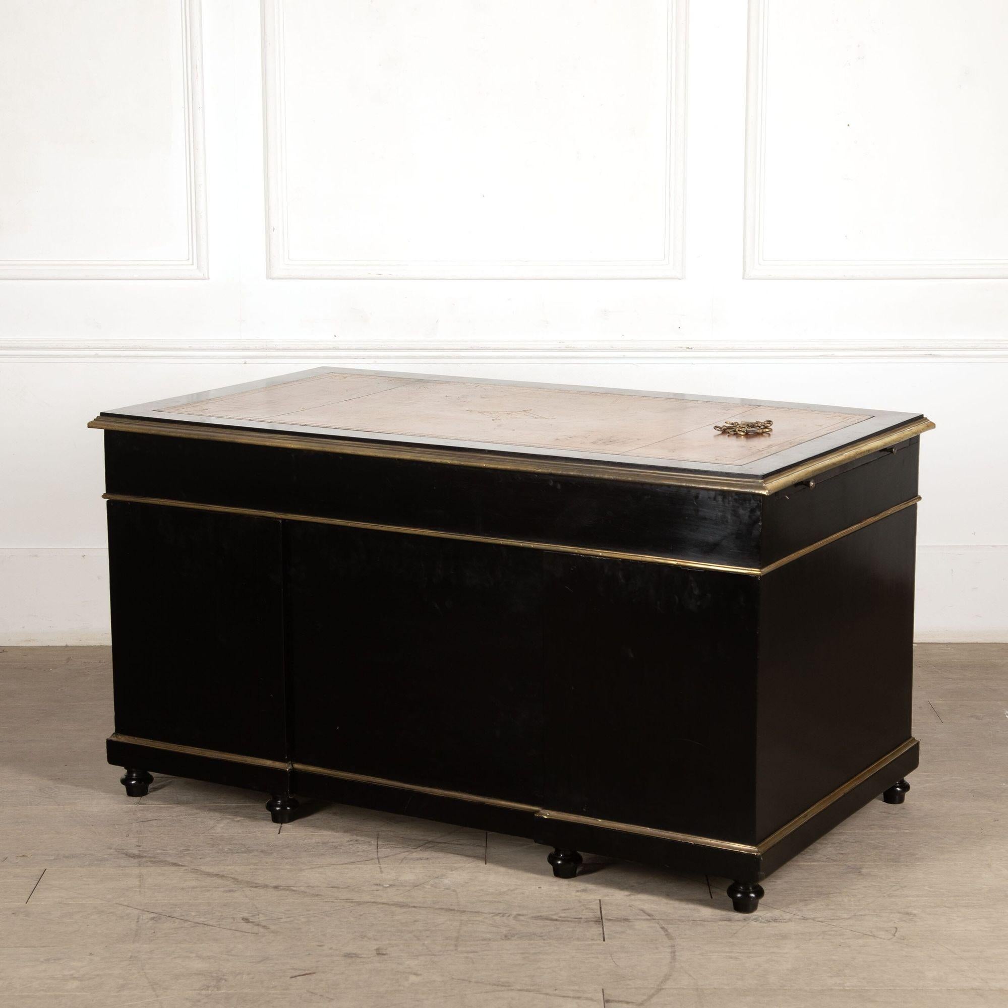 Quality 19th century French ebonized and brass mounted pedestal desk with original inset leather.
circa 1890.