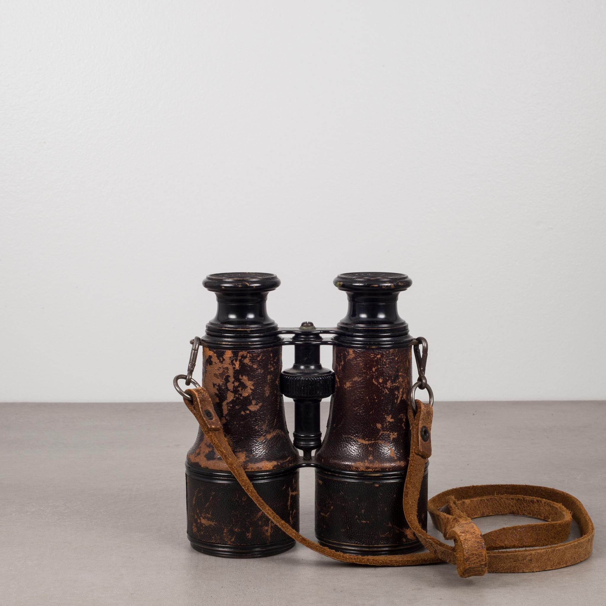 Beautiful pair of leather wrapped, ebonized brass binoculars with original, intact leather strap. Great working order with clear vision. Made in France by LeMaire Paris circa 1880s.