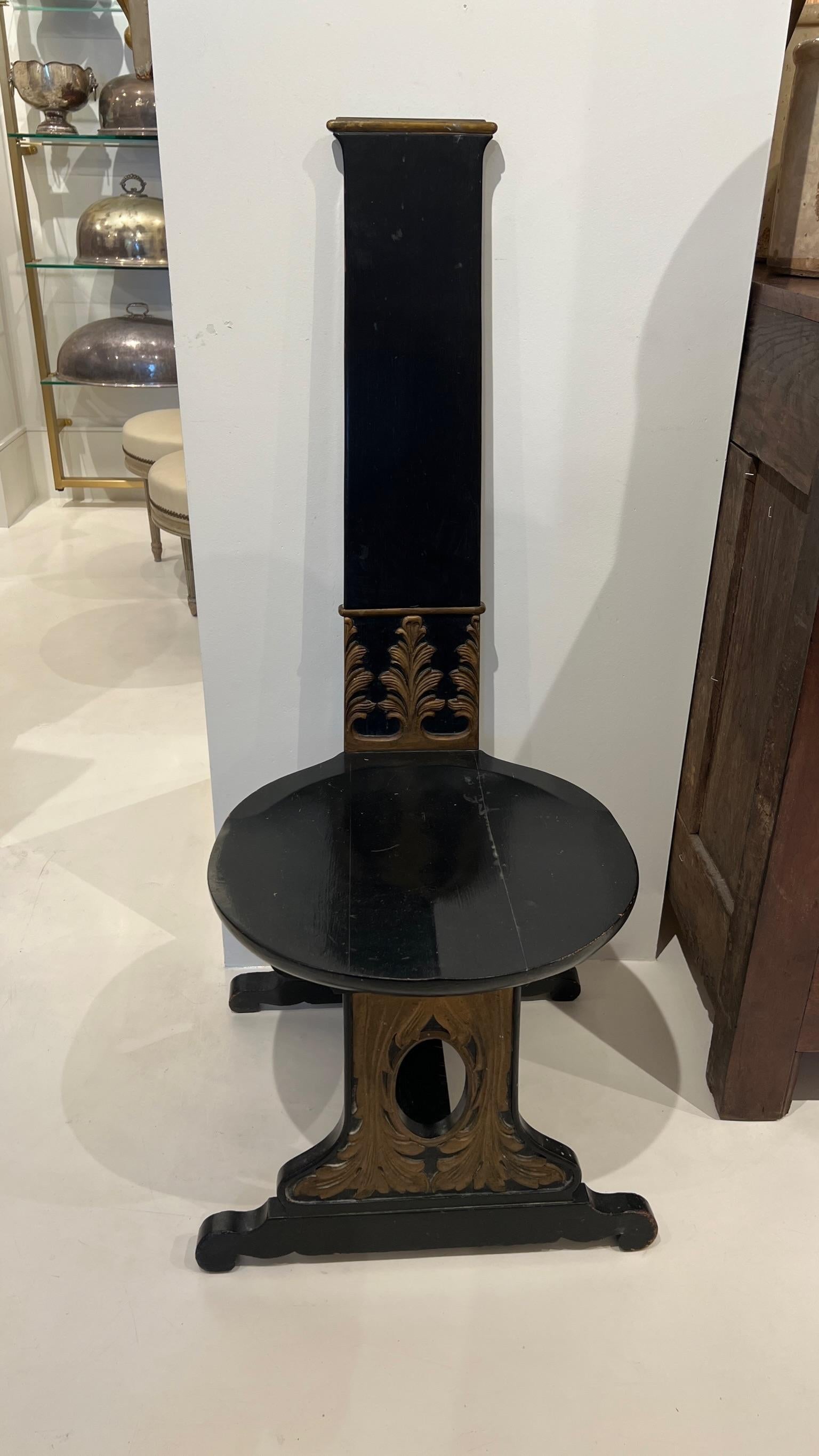 This is a charming pull-up chair with many unique features. It’s small enough to fit in any niche, but has a generous and surprisingly comfortable seat. Painted glossy black with gold accents, the design of the chair is very special. It is