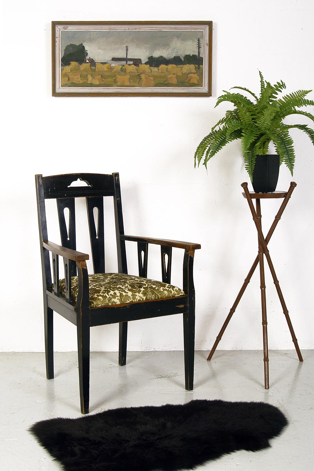 An elegant, and very solid ebonized Swedish armchair dating from the 1880s, with paint loss in all the right places! The seat is nice and wide, which makes it particularly comfortable for an occasional chair - especially when draped with a sheepskin
