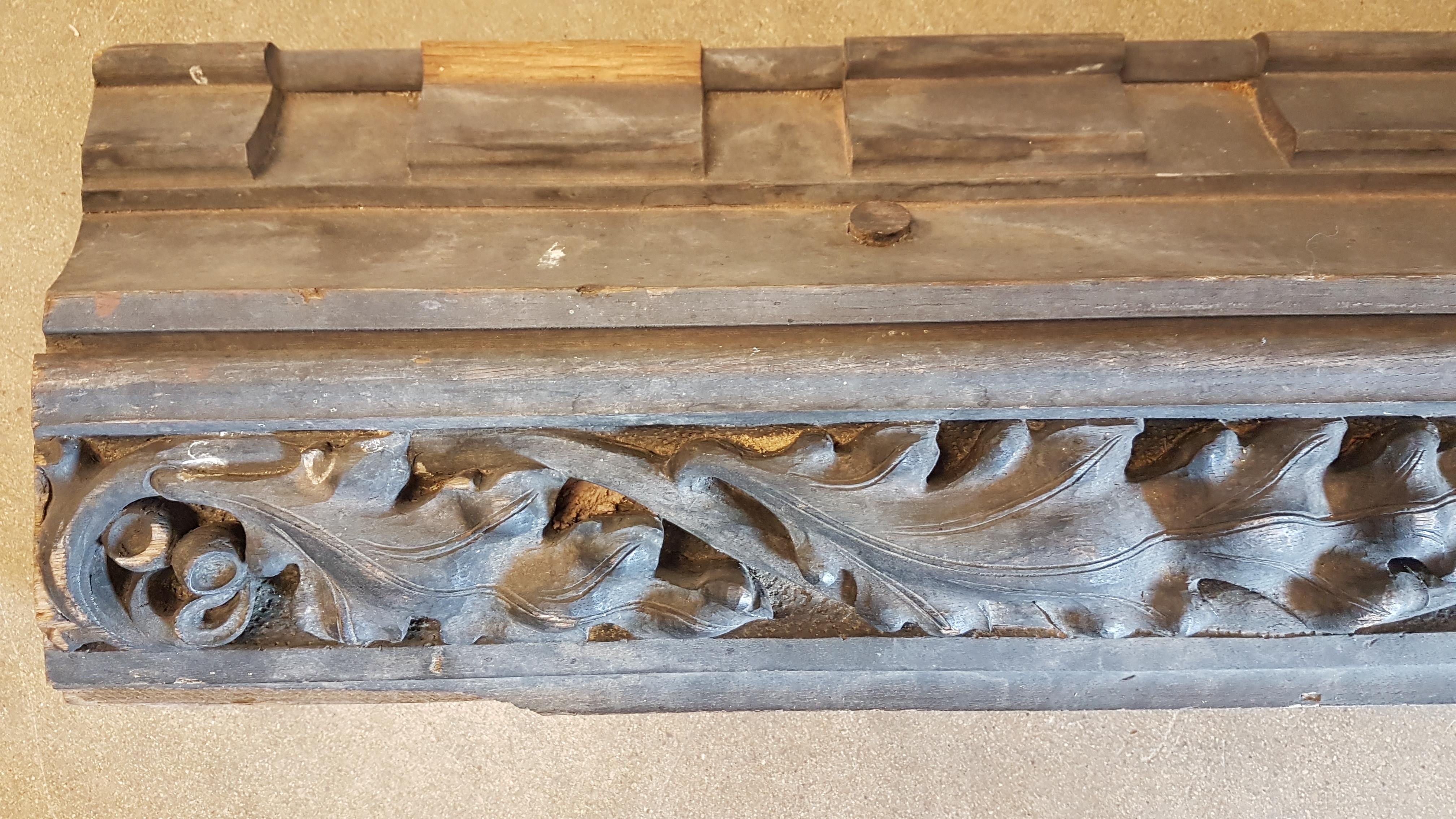A charming large carved ecclesiastical oak beam carved with acorns and oak leaves along its length with the Latin word 'Laudis'. This beam is mid Victorian and in solid oak with great natural weathering and a dry finish. Has a good rustic look to it