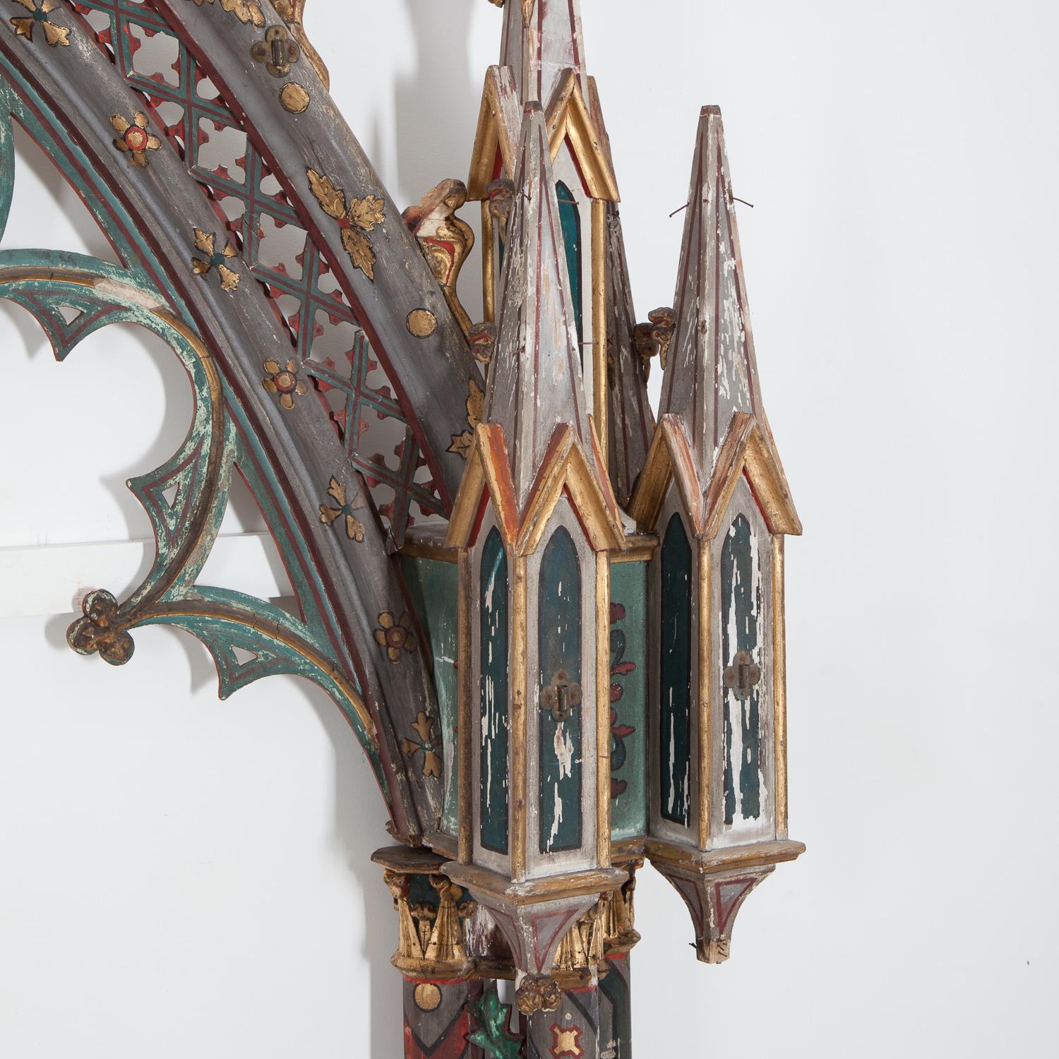 A near pair of spectacular 19th century ecclesiastical painted Gothic arched frames.

Each arch consists of three sections. Both are held together across the width by a new piece of painted wood.
They are lovely decorative pieces, which are in