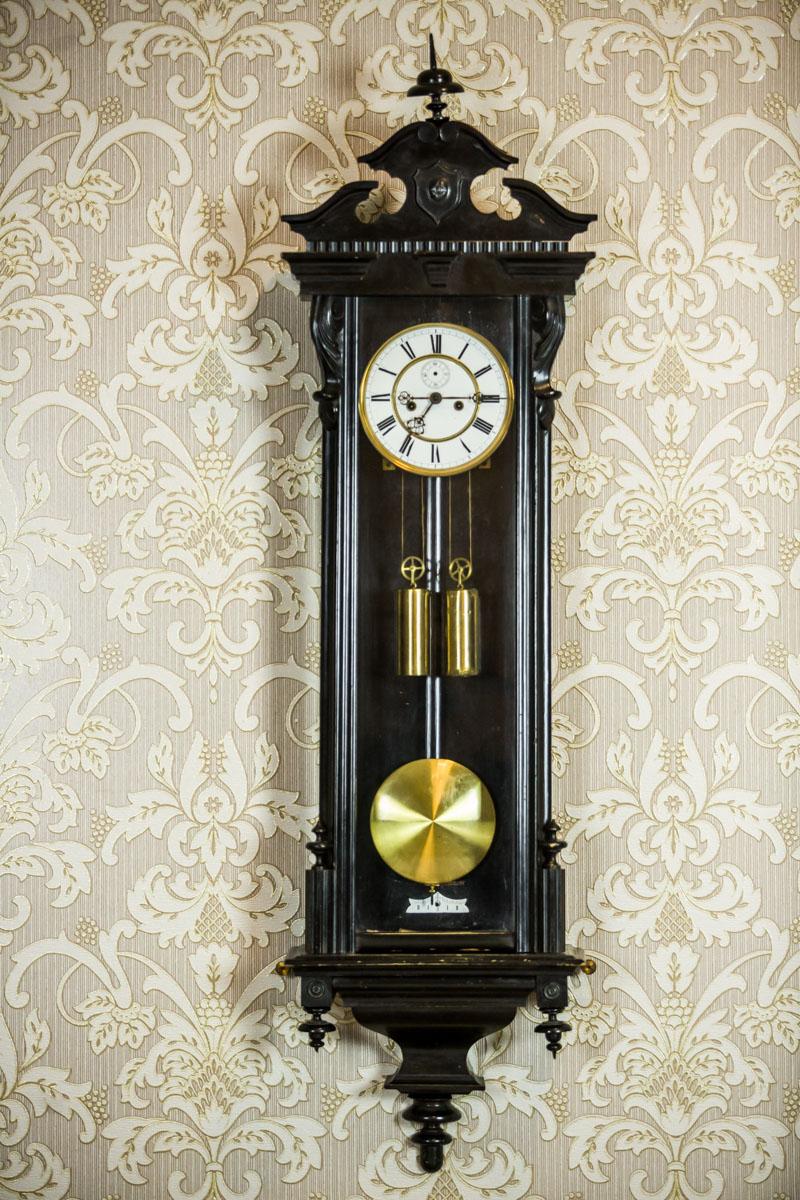 We present you this big wall clock in a black, wooden case, dated fourth quarter of the 19th century.
The mechanism is wound by the crank – with two brass scales.
The clock strikes every full and half an hour.

Presented item is in very good