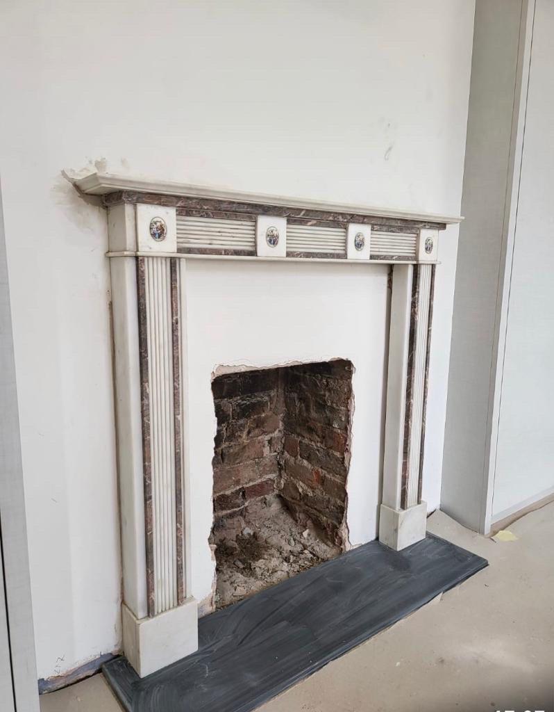 An attractive 19th century Edwardian hand carved Mantle Place. Carved from statutory marble with rouge marble detailing across the jambs and lintel. The lintel features charming figurative porcelain cameos. This fireplace would look lovely as a
