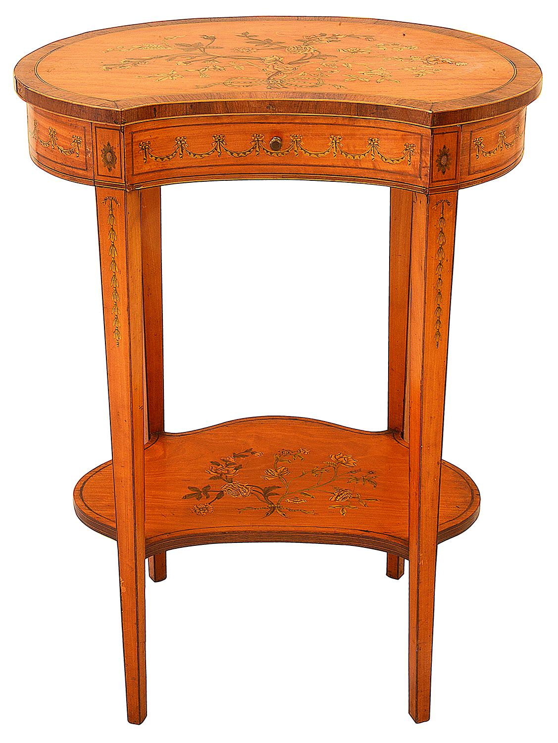 A fine quality Sheraton revival Satinwood, marquetry inlaid two tier side table, stamped 'Edwards + Roberts'
Having classical floral and ribbon decoration to the top, a single frieze drawer, square tapering legs and a matching under tier.