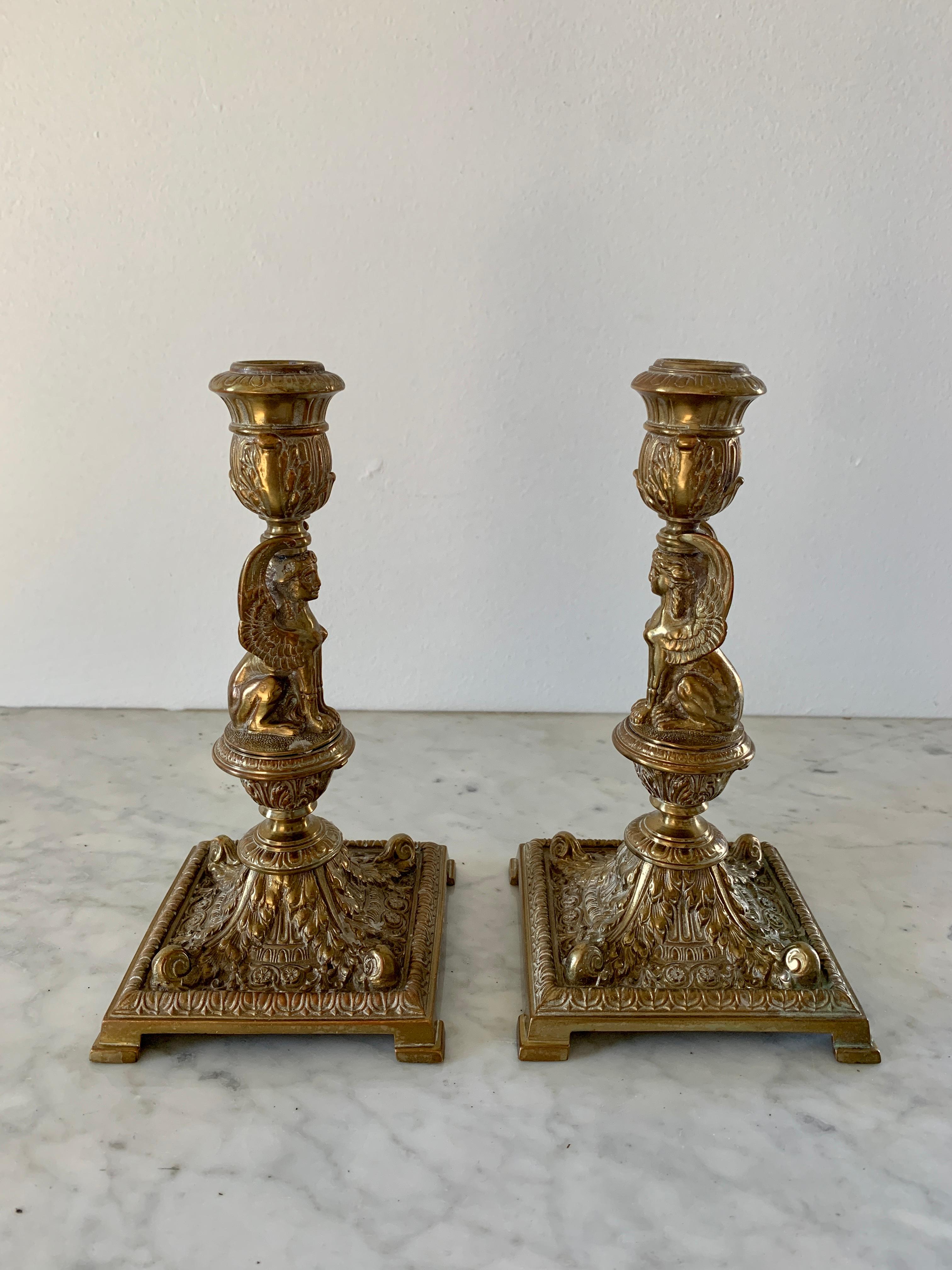A wonderful pair of gilt bronze Egyptian Revival candlestick holders featuring Sphinxes.

Late 19th Century

Measures: 4.88