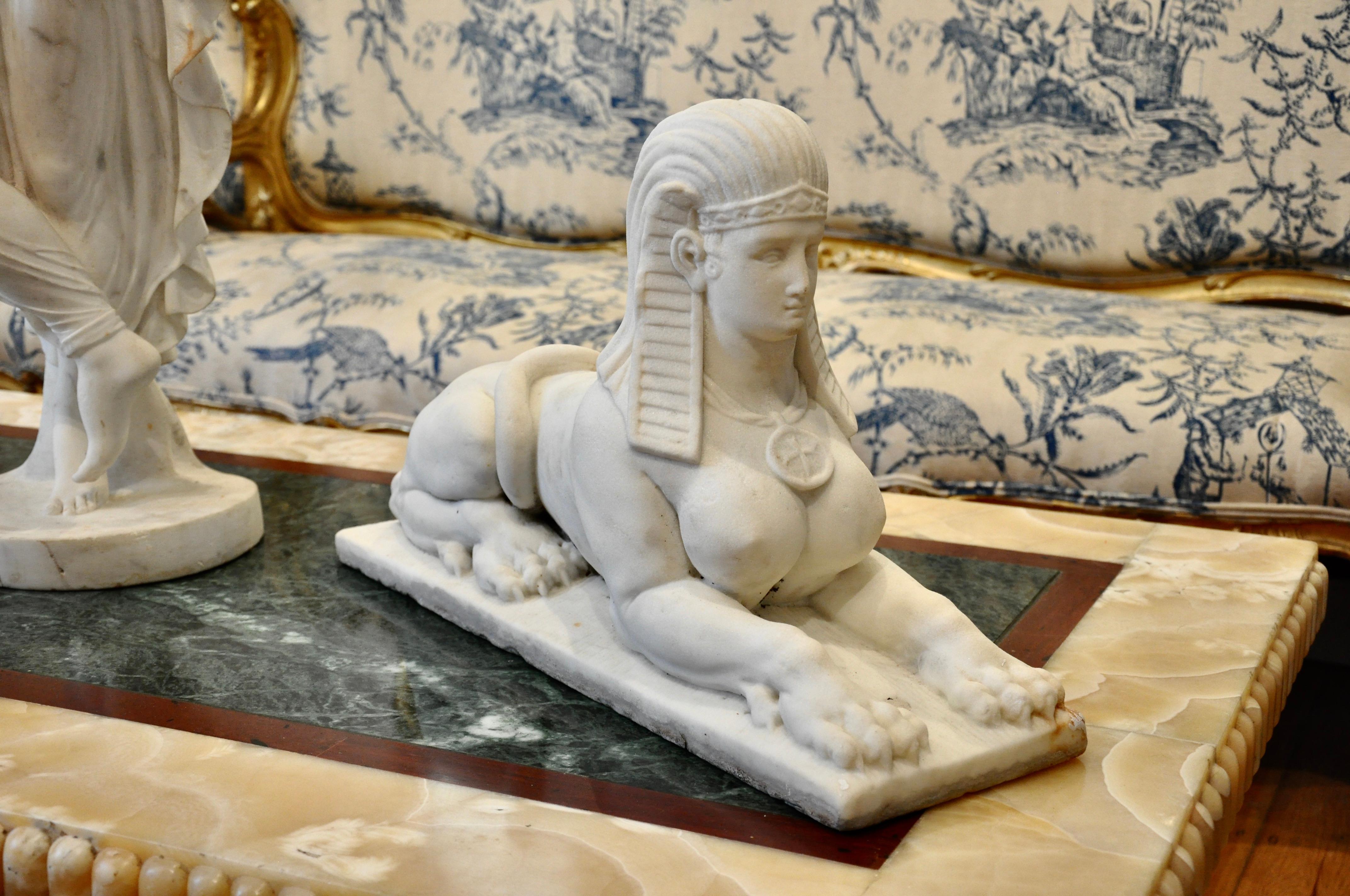 Carved marble sphinx. Wonderful detail, patina and form

Lion body and Egyptian head

See cutout of hind quarter that was mounted to stairs.