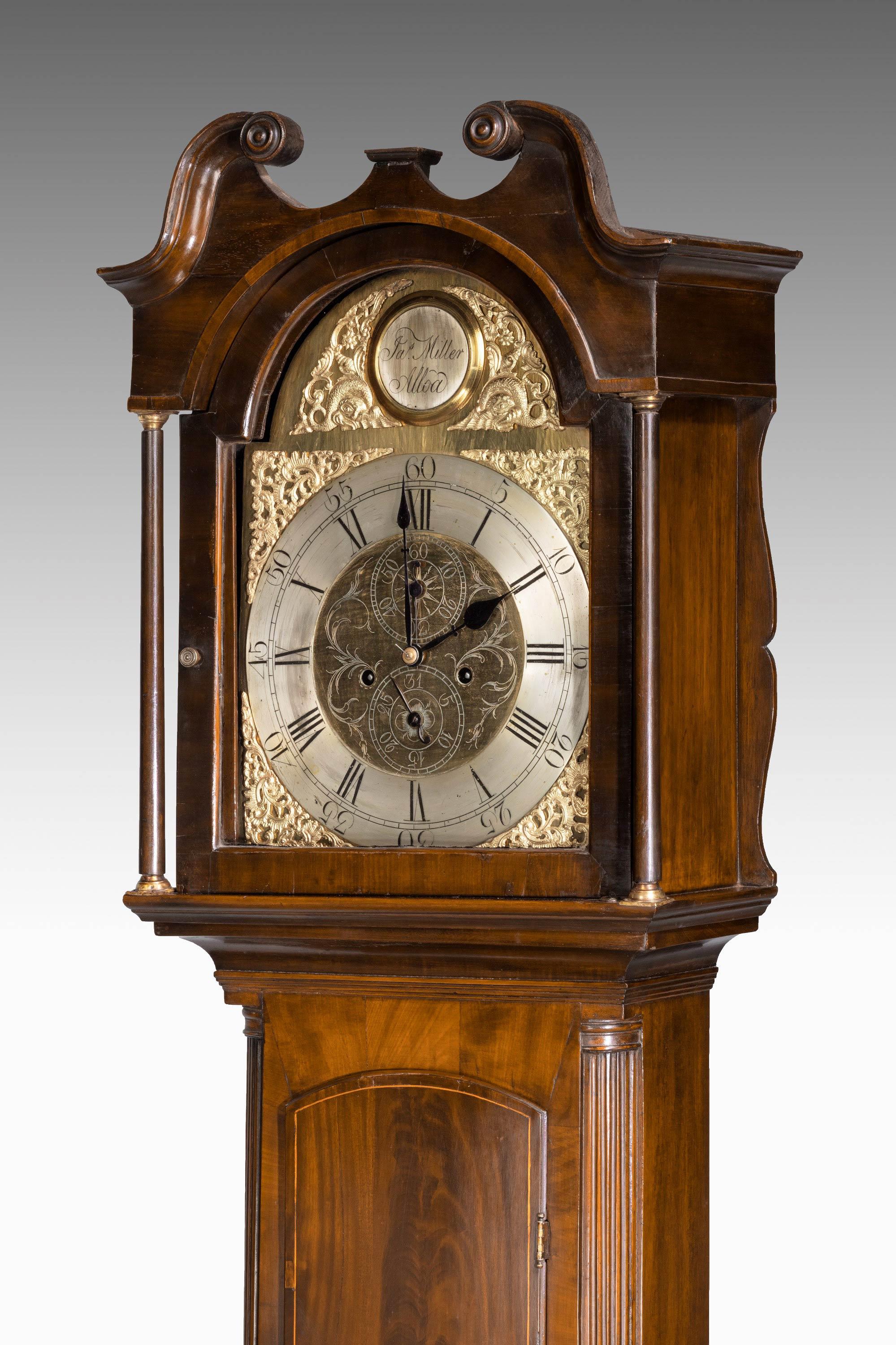 A small early 19th century arch dial eight day longcase clock by Jas Miller of Alloa. Scotland With beautifully cast details to the face. Second hand to the base of the arched dial. The top signed in the tablet. Complex crossbanded case in very good