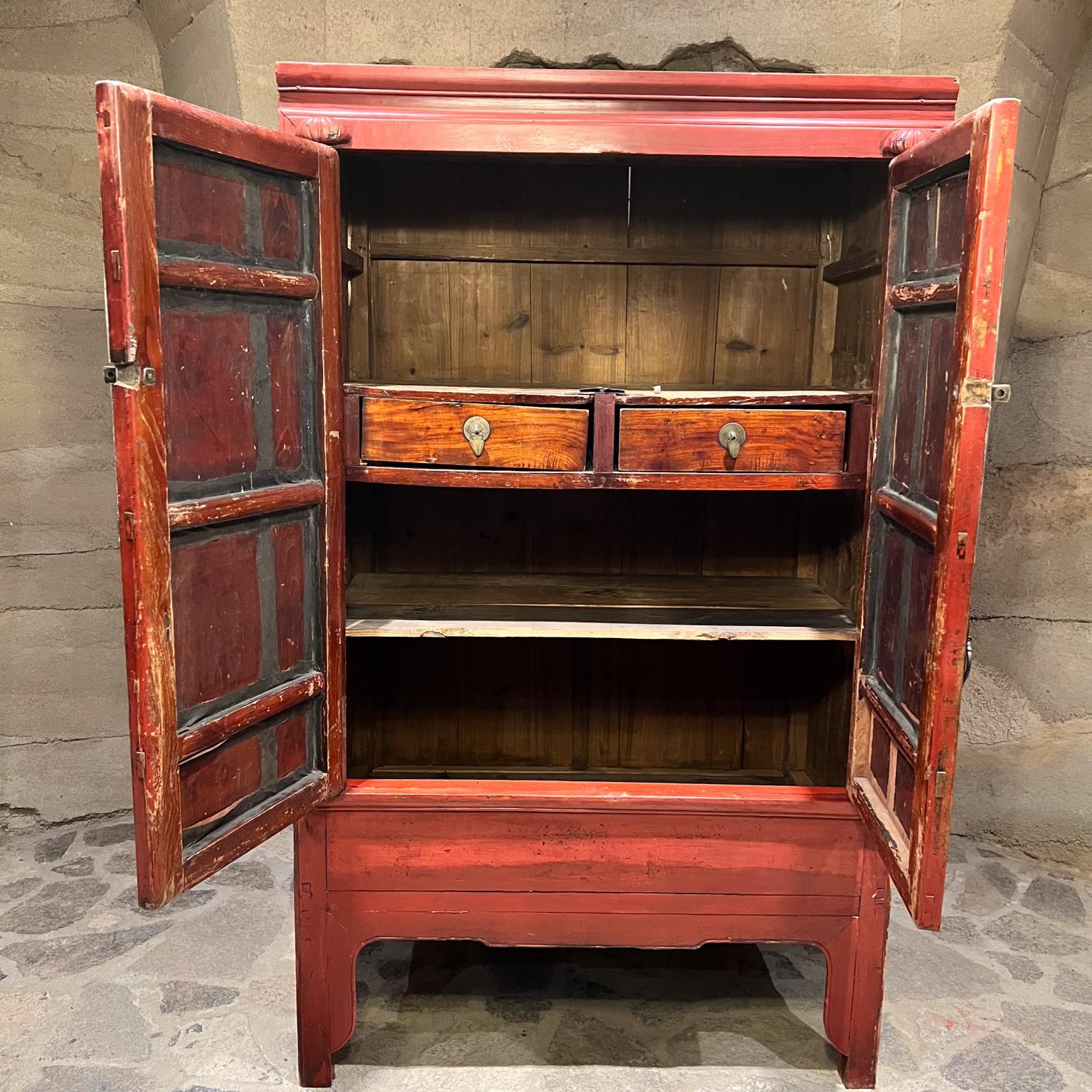 19th Century Elegant Antique Red Chinese Cabinet Wedding Chest
Wood Brass
69 h x 42 w x 24.5 d
Bottom storage 18.5 h x 22 d x 40.25
Storage middle 10.25 h
Storage top 19
Drawers 14 w x 19 d x 3.5 h
Preowned unrestored original vintage antique