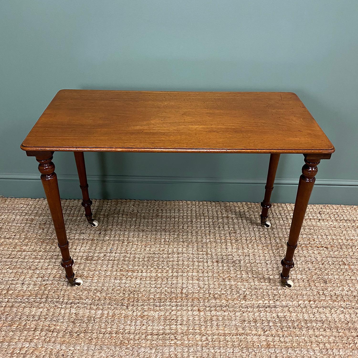 Elegant Victorian Mahogany Antique Side Stretcher Table

This Fine Quality 19th Century Victorian Mahogany Antique Stretcher Table Side Table / Lamp Table / Sofa Table dates from ca. 1870 has a beautifully figured top above four elegantly turned