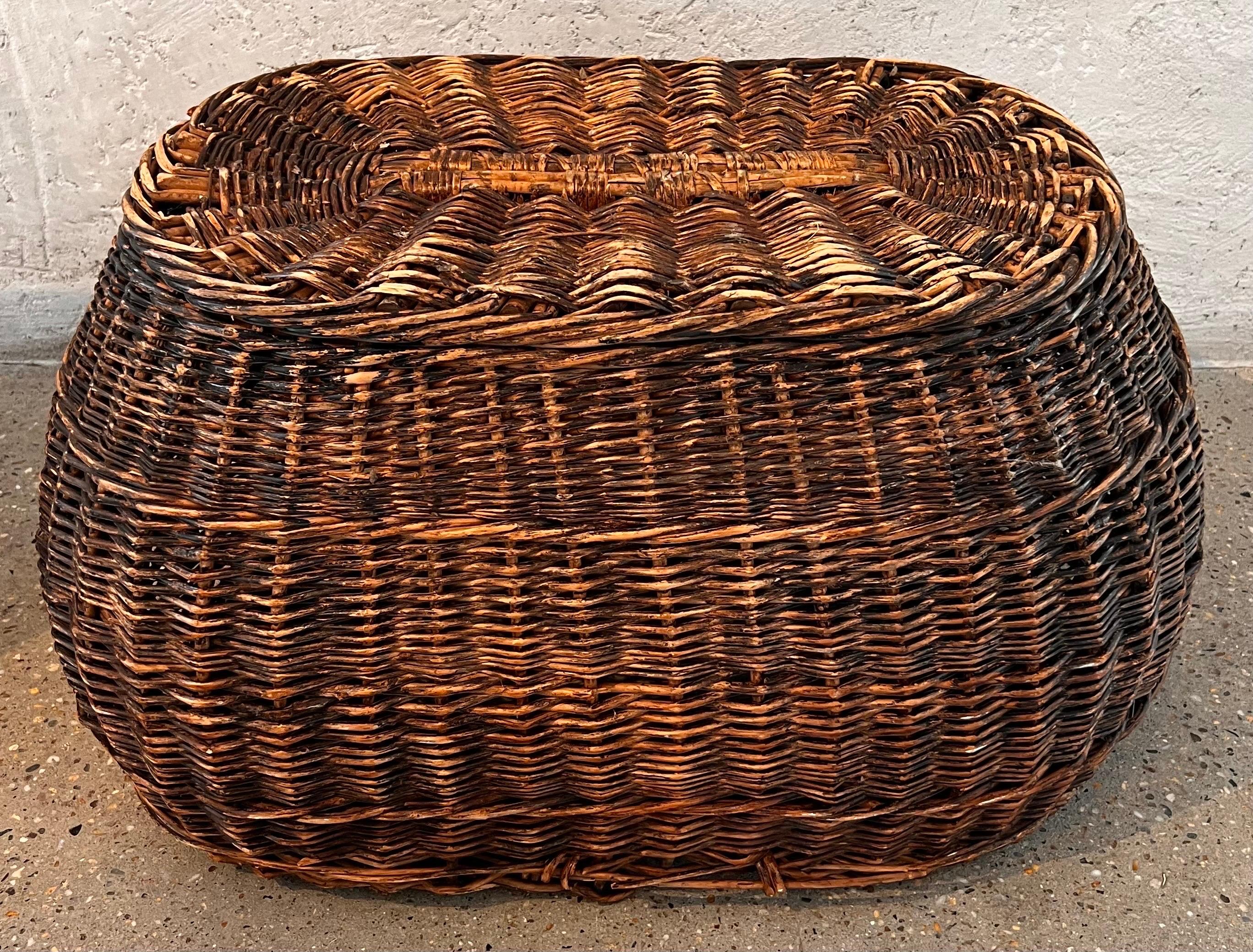 The Basket was hand woven in the 1800s and over time the top edge has seen a bit of damage although, the breakage is quite elegant and runs only along the top top. 
The rest of the basket is sturdy and beautiful.