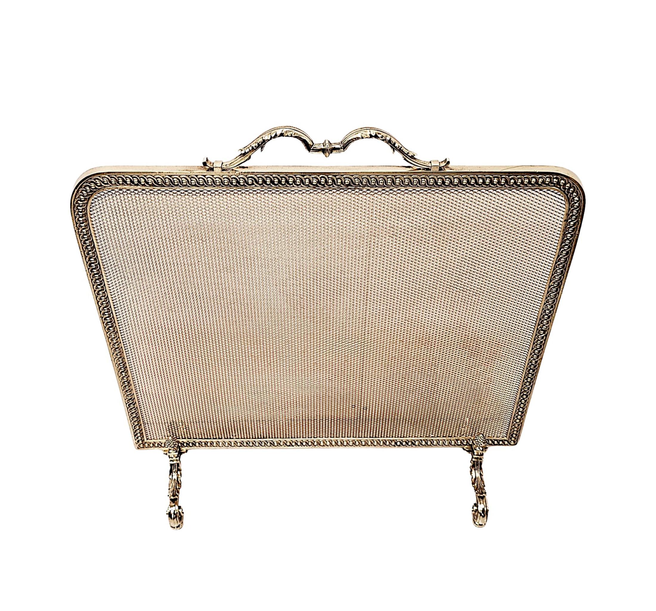 A lovely 19th Century elegant polished brass fire screen of large proportions, fabulous quality and fully restored.  The protective wire mesh of rectangular form is set within a beautifully simple finely cast polished brass frame with gorgeous