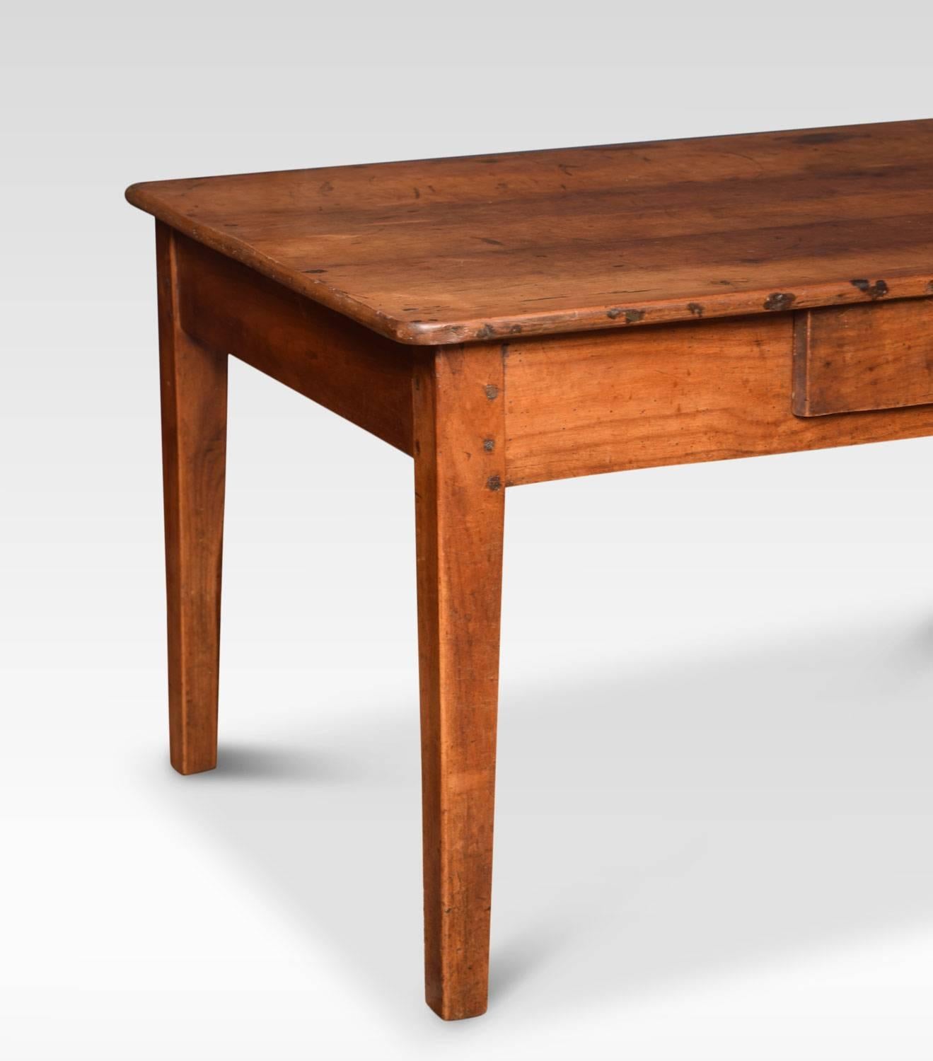 19th century elm coffee table, the plank top fitted with a single frieze draw, raised on tapered square section legs. (Adapted)
Dimensions:
Height 21 inches
Width 37 inches
Depth 25 inches.