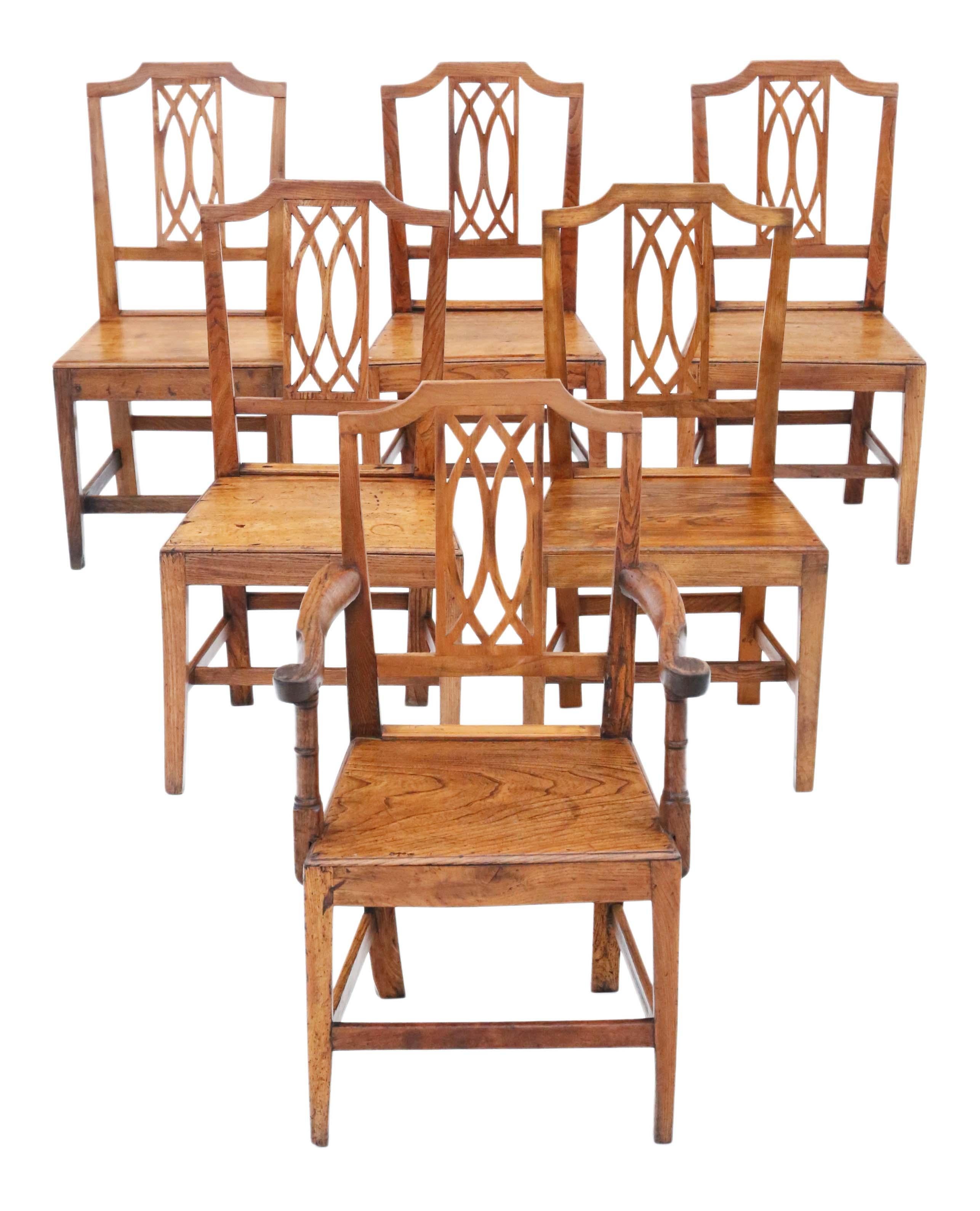 Discover the rare elegance of this antique set of 6 (5 chairs plus 1 carver) 19th Century elm kitchen dining chairs, boasting a design that is truly unique. These chairs are a testament to quality craftsmanship, with solid construction and no loose