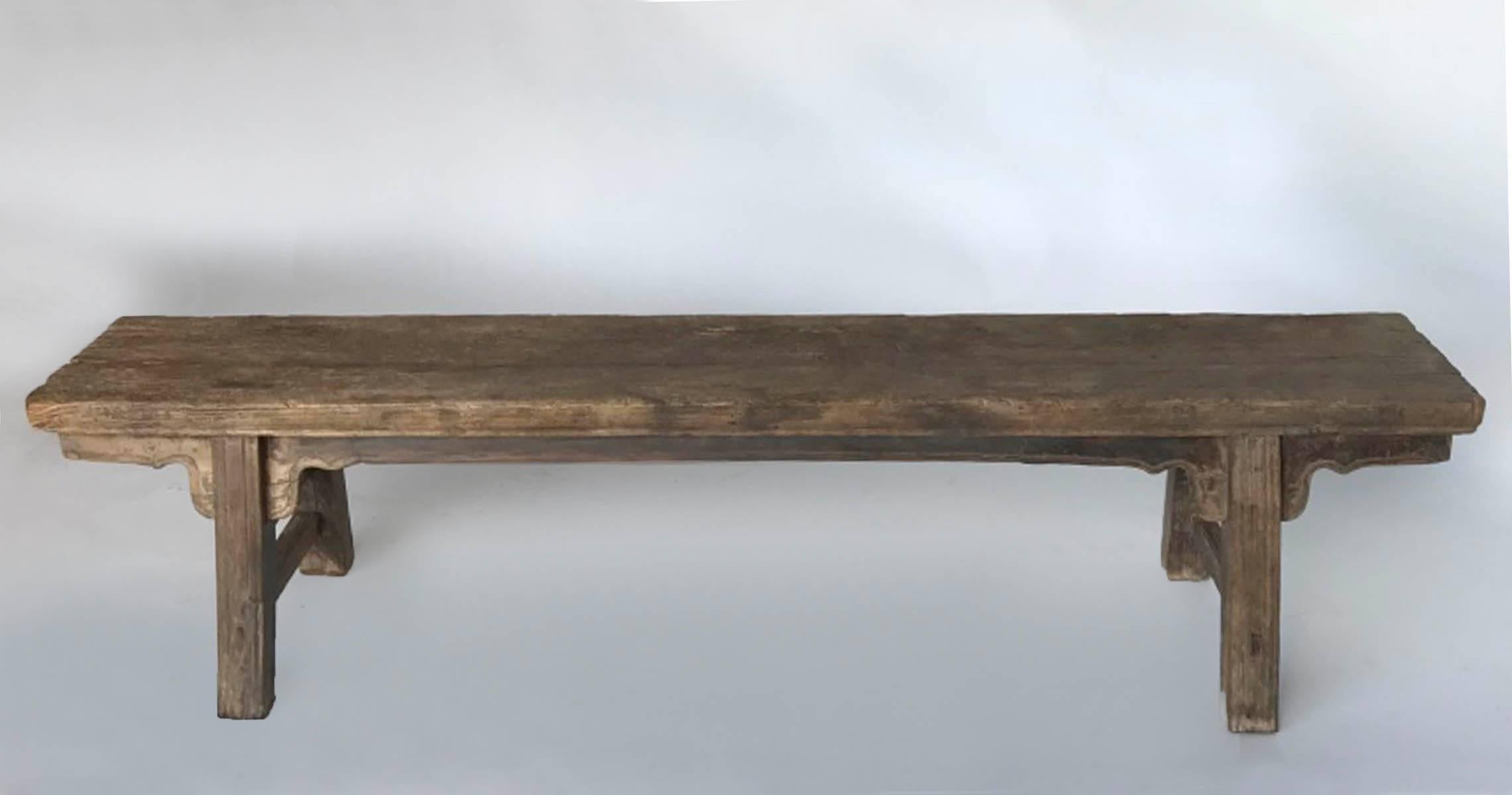 19th century Chinese plank bench made of elm. All original. Mortise and tenon construction. Carved detail on apron. Beautiful old wood with natural grey patina Smooth to the touch. Sturdy and functional.