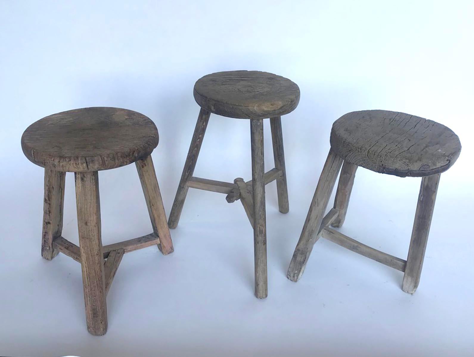 19th c. Chinese elm stools with various base configurations. Smooth, weathered, worn grey patina. Mortise and tenon joinery. Great for extra seating, a small side table or as a plant stand.
Sold separately, $785 each. Please refer to left, middle or