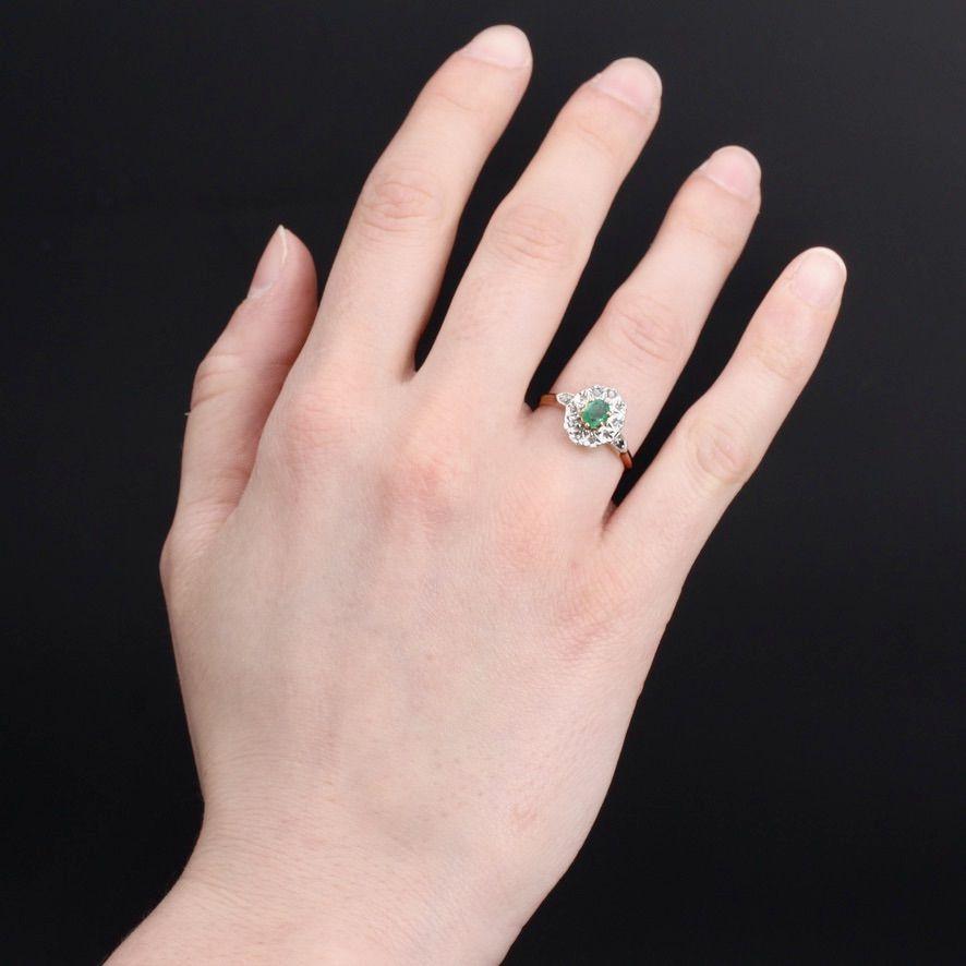  Ring in 18 karat rose gold.
Charming antique pompadour ring, it is set with claws of an emerald in the center in an entourage of rose- cut diamonds.
Total weight of the emerald : about 0.29 carat.
Height : 11.8 mm, width : 9.2 mm, thickness : 5.7