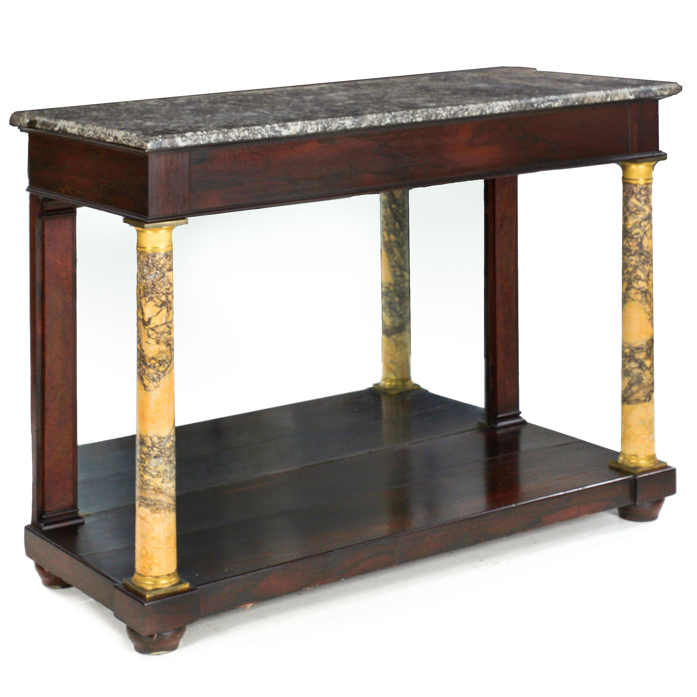 EMPIRE MAHOGANY PIER TABLE WITH MARBLE COLUMNS
Continental, circa mid-19th century
Item # 109OYP14M 

A good 19th century pier table with a gray marble top situated over a squared apron with flamed mahogany veneers raised over sienna marble columns