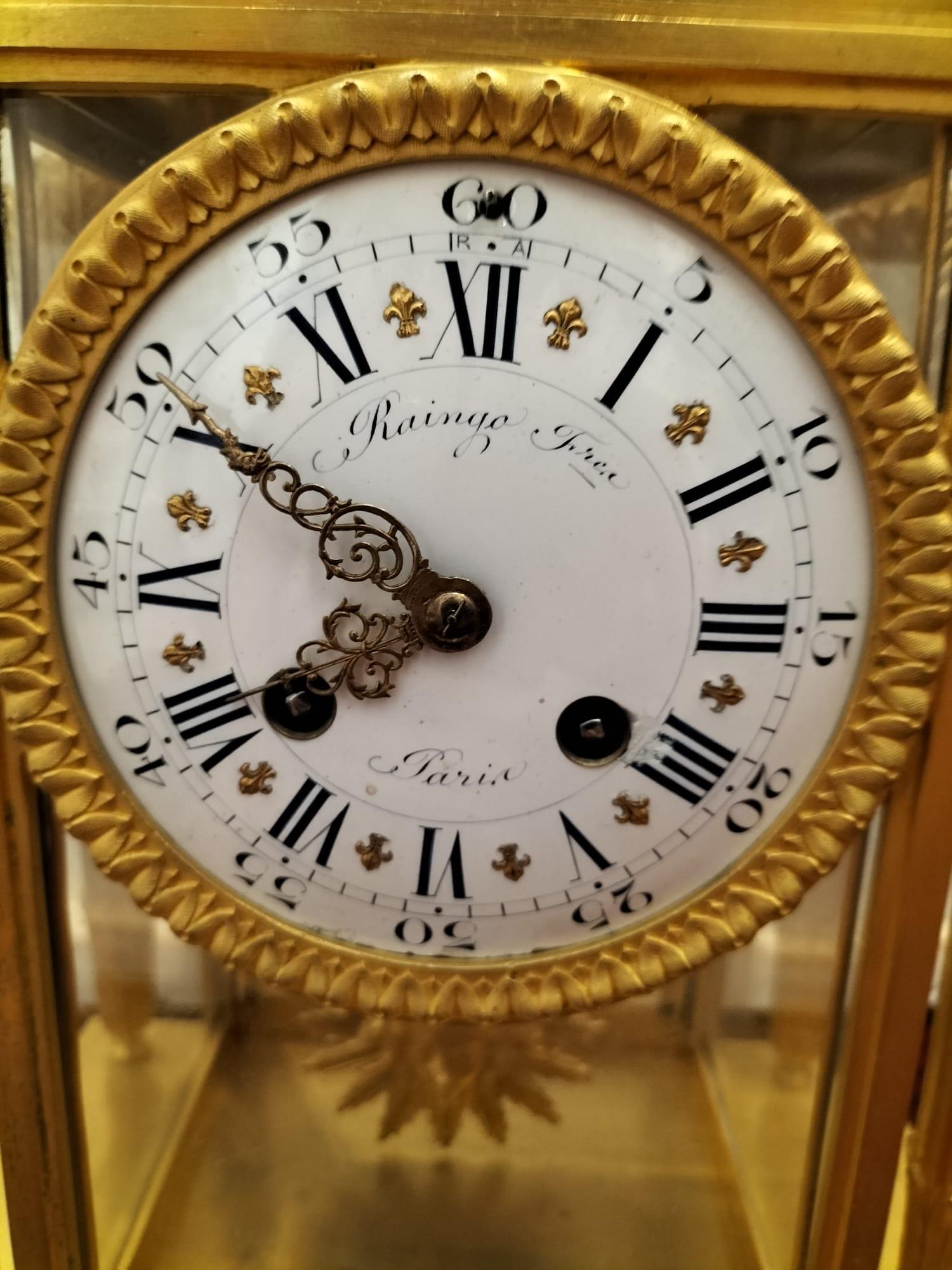 Bronze Pendule en bronze doré et marbre bleu Turquin, Raingo Frères, XIXe siècle.