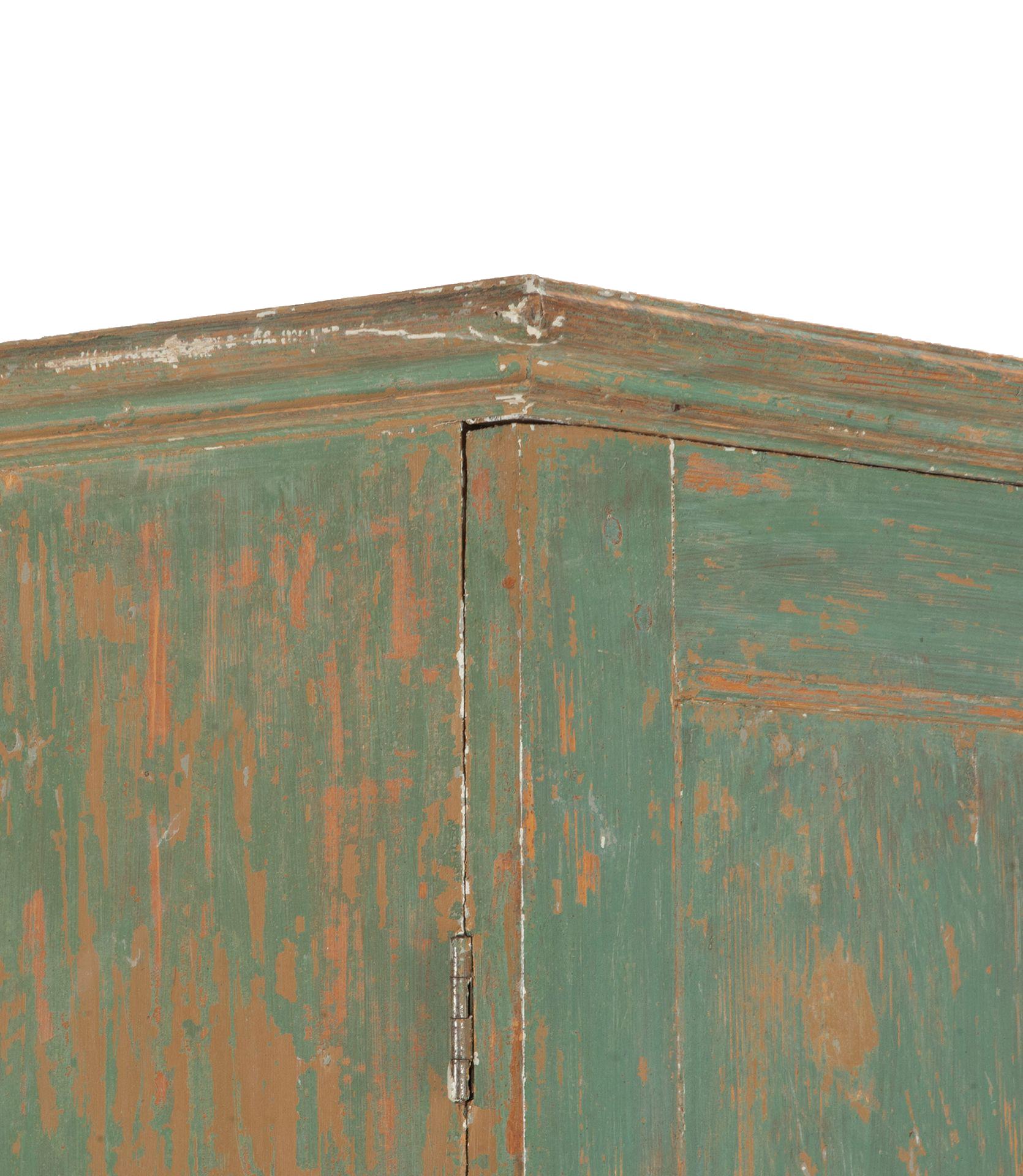 19th Century Empire column cabinet from Northern Sweden.
A useful piece of furniture for one of those difficult to fill spaces. 
With good storage and scraped to original paint.
Later key locks. Circa 1880.