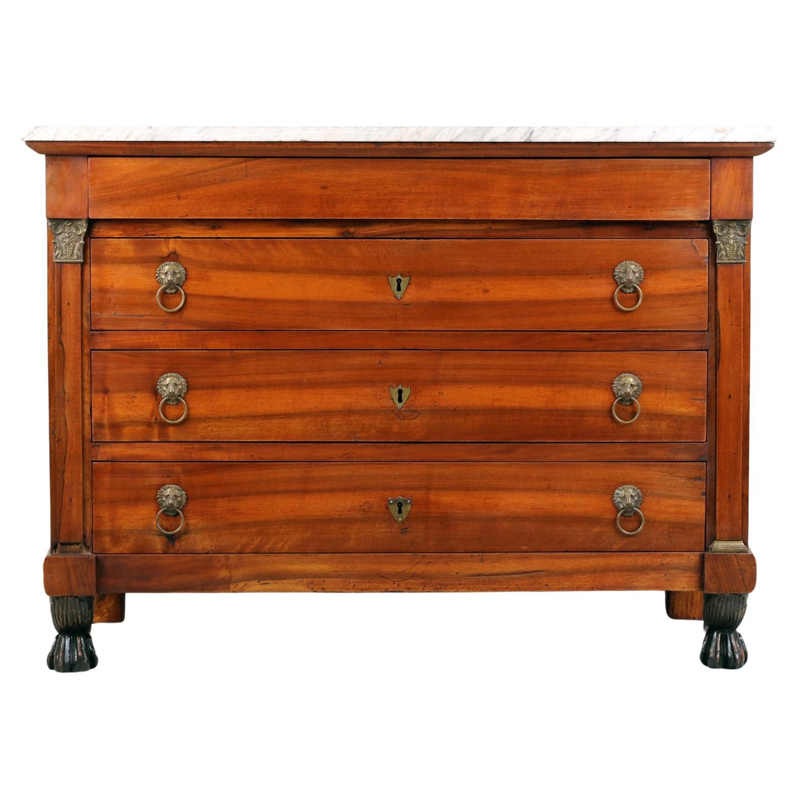 Empire Chest od Drawers with white marble on top,
France, Ca. 1830

Spectacular Commode with original white marble on top and original empire legs. Front of drawers and sides of the body made of solid walnut.  Pilasters with brass bases and