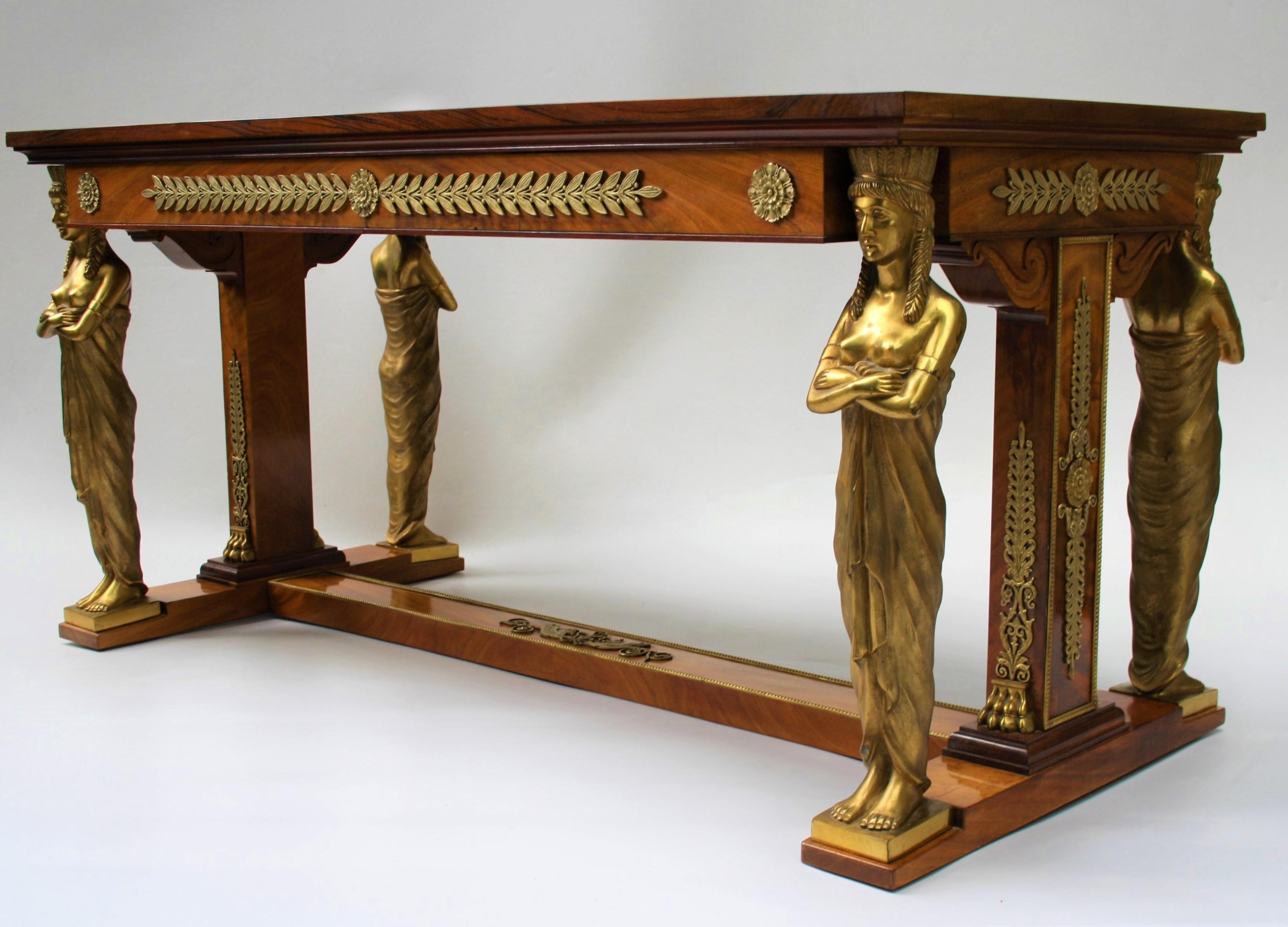 Exceptional 19th century Empire style desk after a design from Jacob-Desmalter
Made of flamed mahogany supported on the heads of four finely cast gilt bronze female caryatids, and richly decorated with beautiful bronze fittings and black leather