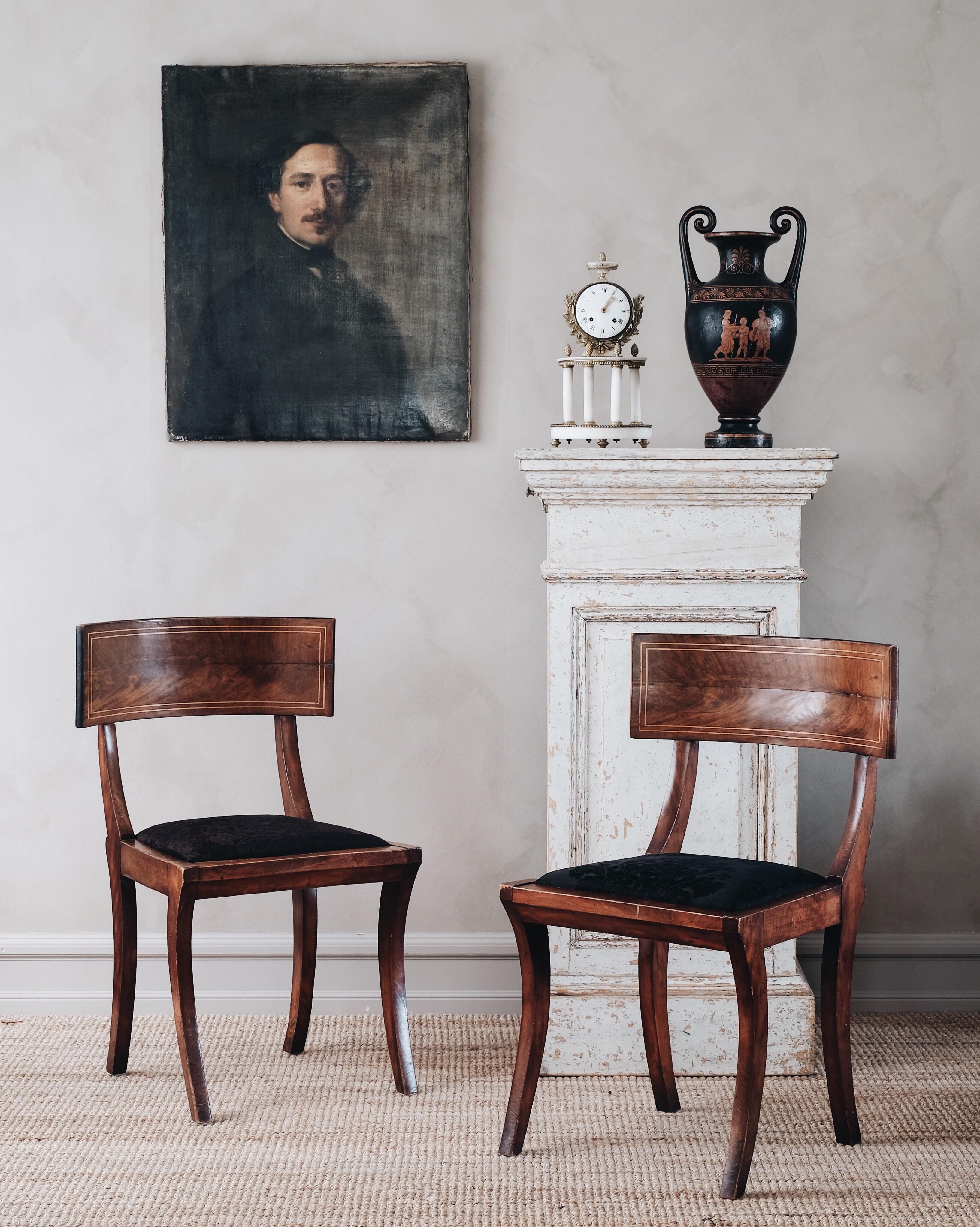 A fine pair of 19th century solid mahogany Scandinavian Empire Klismos chairs, circa 1820. Good condition with wear and tear consistent with age and use.